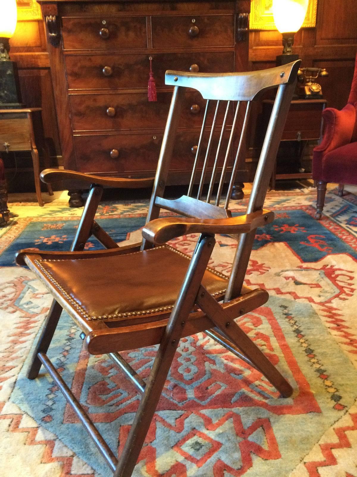 A Victorian Campaign style folding oak desk chair, circa 1870, with studded seat, excellent antique condition with beautiful patina to the frame.