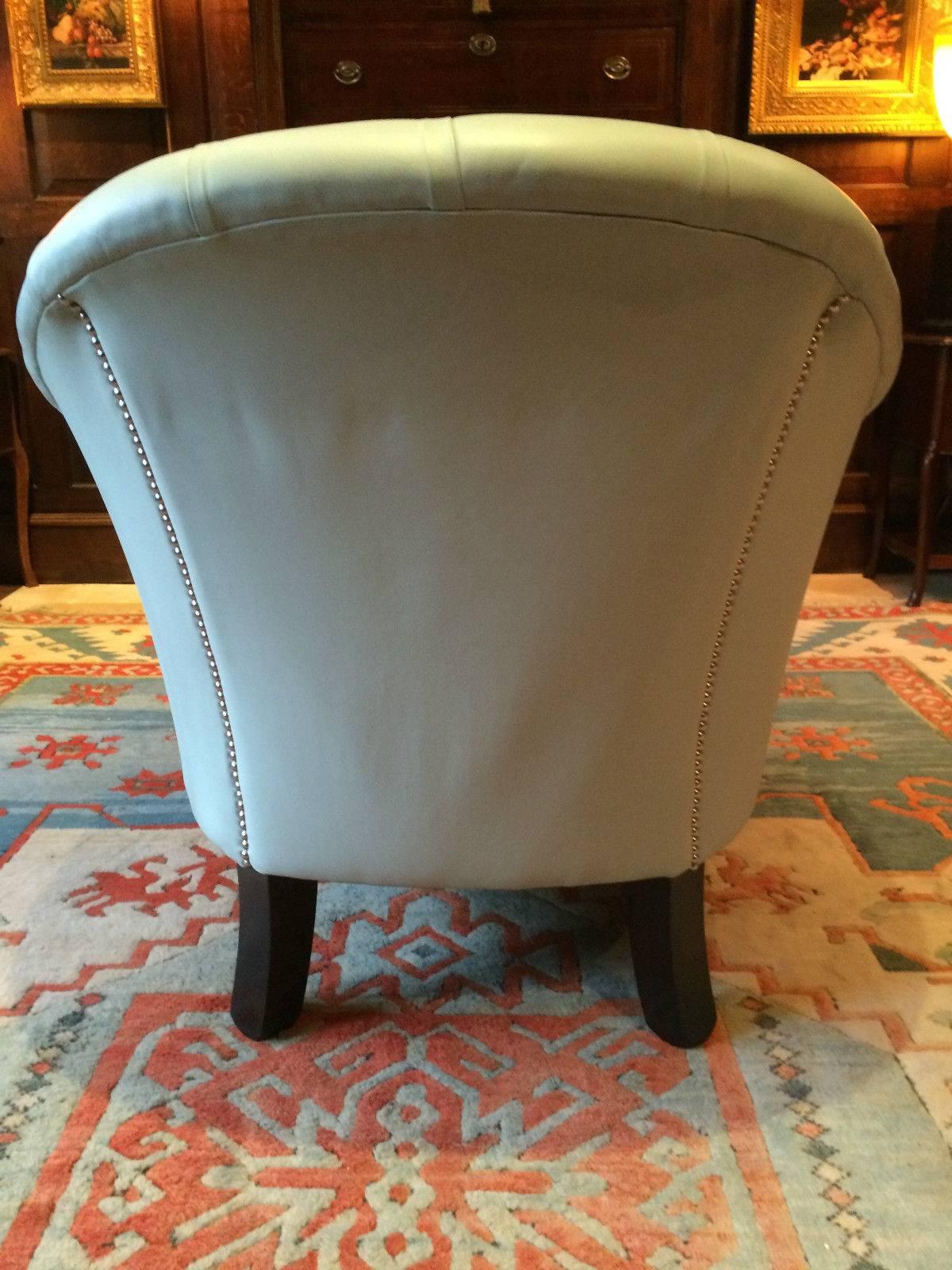 Antique style 'Club Chair' mahogany framed studded and leather button back with curved back, finished in a ‘Duck Egg Blue’ soft leather, standing on square tapering legs, the armchair is offered in excellent condition with no weakness to the joints,