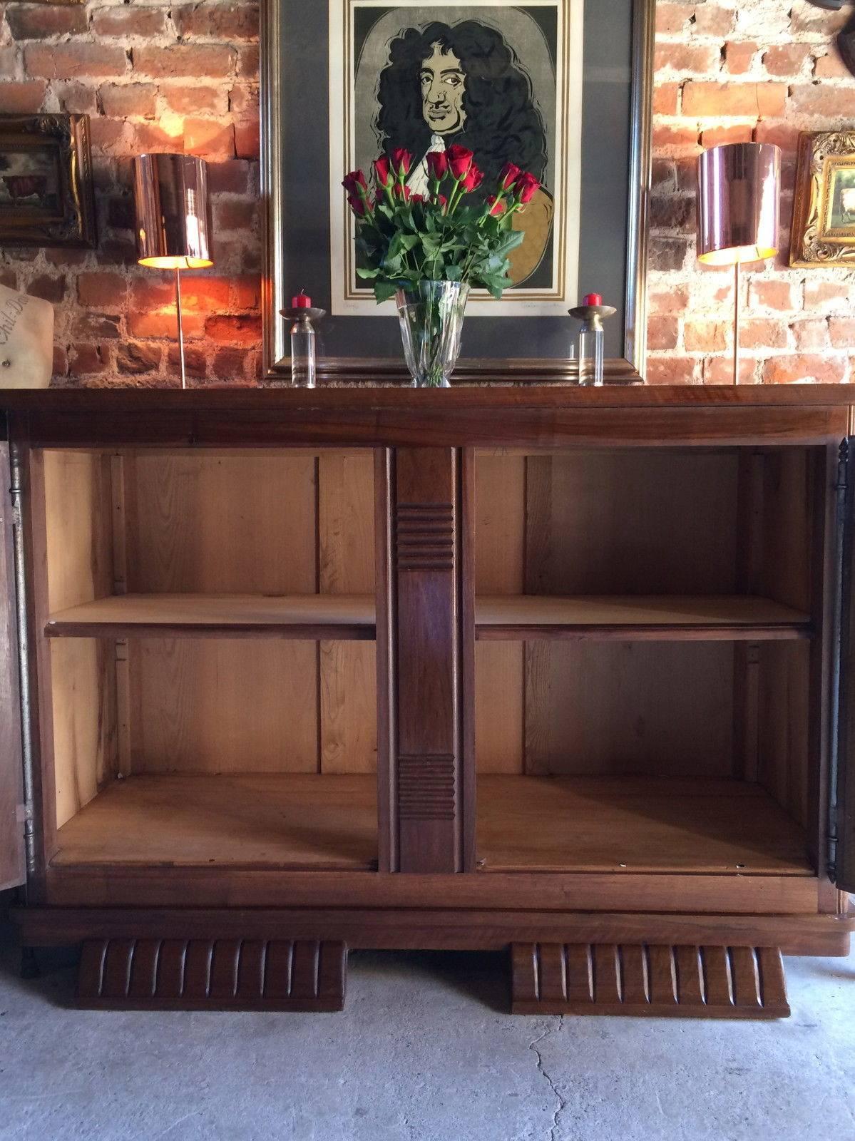 Early 20th century Art Deco style sideboard credenza, rectangular top over two large deco stylized paneled cupboard doors with heavy metal brackets and escutcheons, comes with two original working keys with tassels, raised on two bulbous feet, this