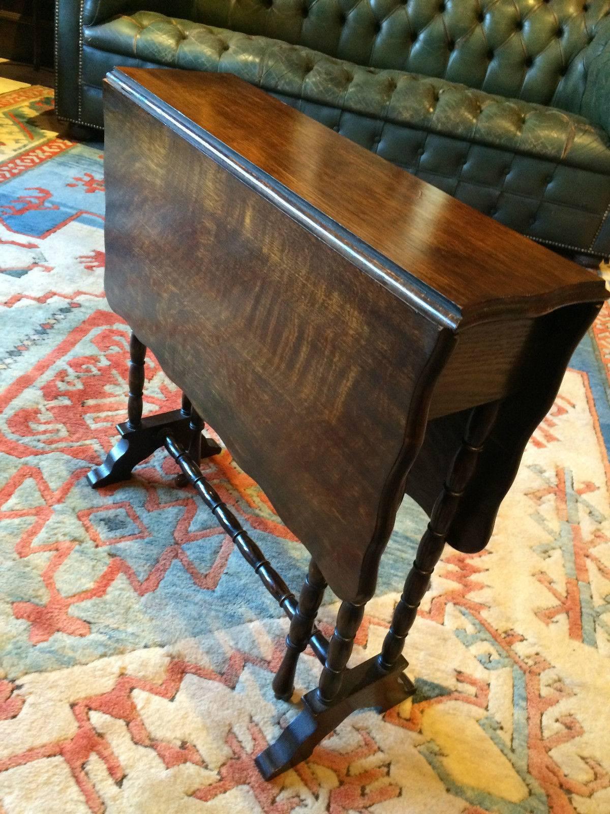 Antique 19th century Victorian cottage style drop-leaf side table, rectangular scalloped top with two drop leaves over cotton real legs with two pull-out legs on casters, lovely aged wood with glorious patina.