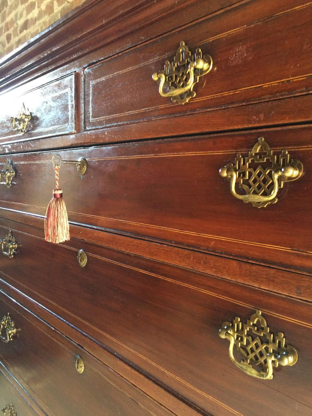 A tall and substantial, 19th century mahogany 'Tallboy' bedroom chest of drawers dresser, the top with moulded cornice over two short drawers over five long graduated drawers, total seven drawers all with original brass swan drop handles and brass