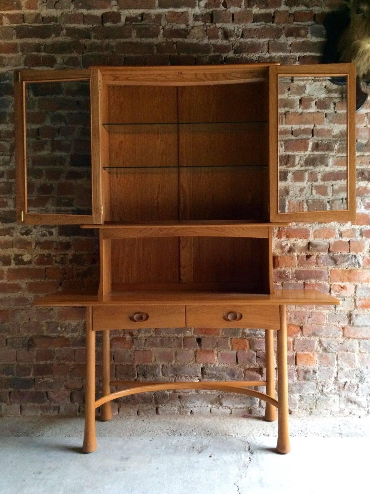 A rare limited edition Ercol 'Kelmscot Range' solid Elm cabinet dated 1987 and numbered 104 of 125, signed and authenticated by Lucian B Ercolani chairman of Ercol. The piece is offered in almost as new condition and is museum quality.
The piece