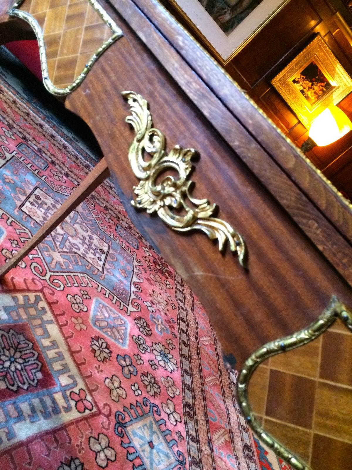 A beautiful distressed Louis XV style games table, with kingwood veneers with floral marquetry, scalloped fold over top with green baize, ormolu mounts to the front, sides and legs, standing on four tall cabriole legs, the table has lost lots of