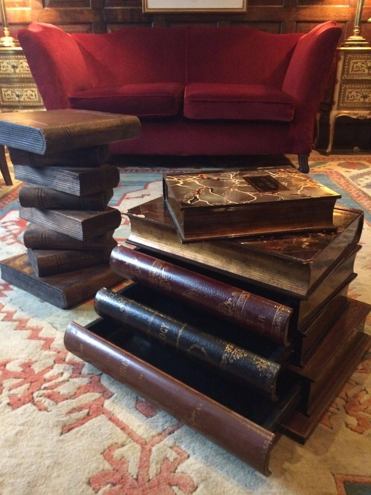 A stunning and unique pair of side tables in for form of book stacks. One stack having three drawers, with a singular faux book having inner secret compartment.
  
