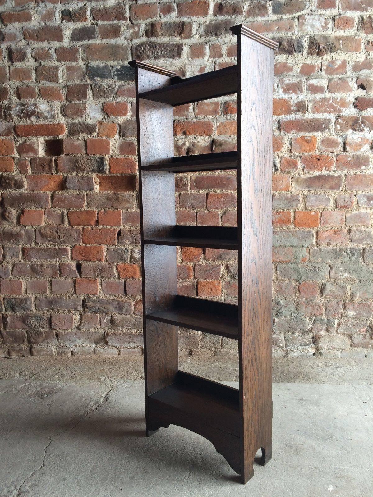 A stunning narrow Edwardian oak arts and crafts bookcase with five shelves.
