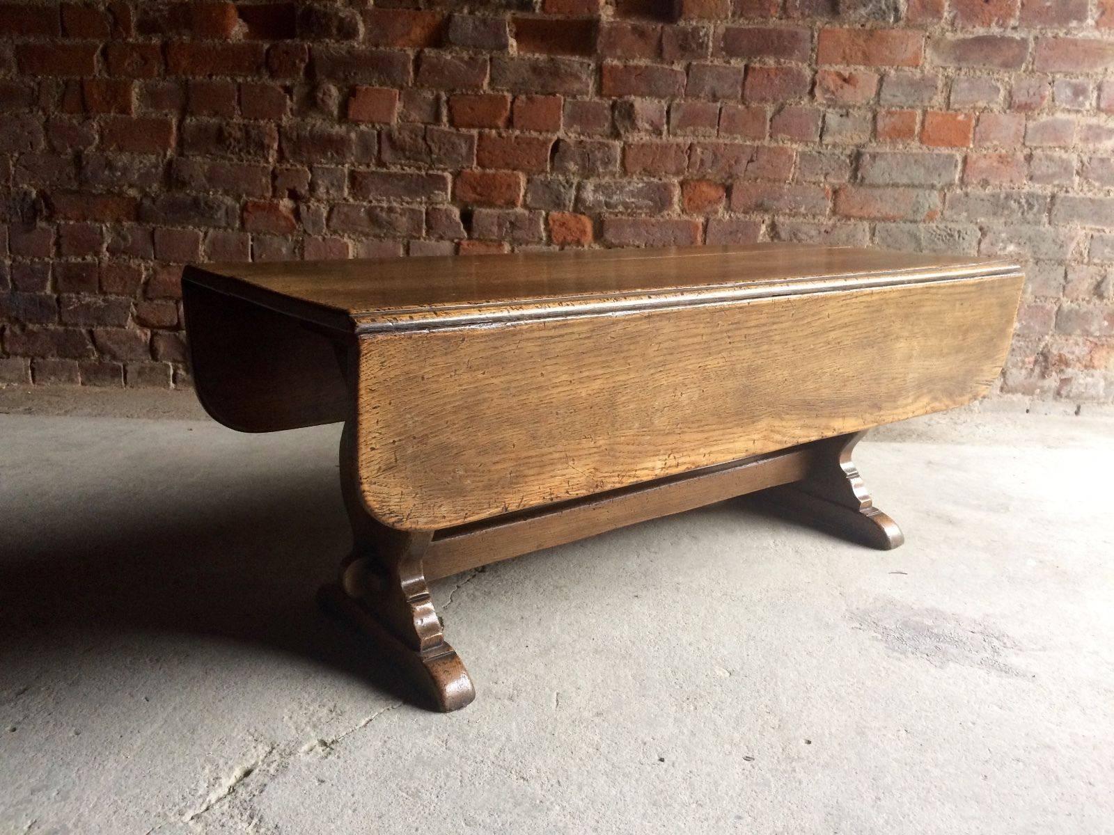 A beautiful solid oak 19th century rustic cottage coffee table with drop down flaps.