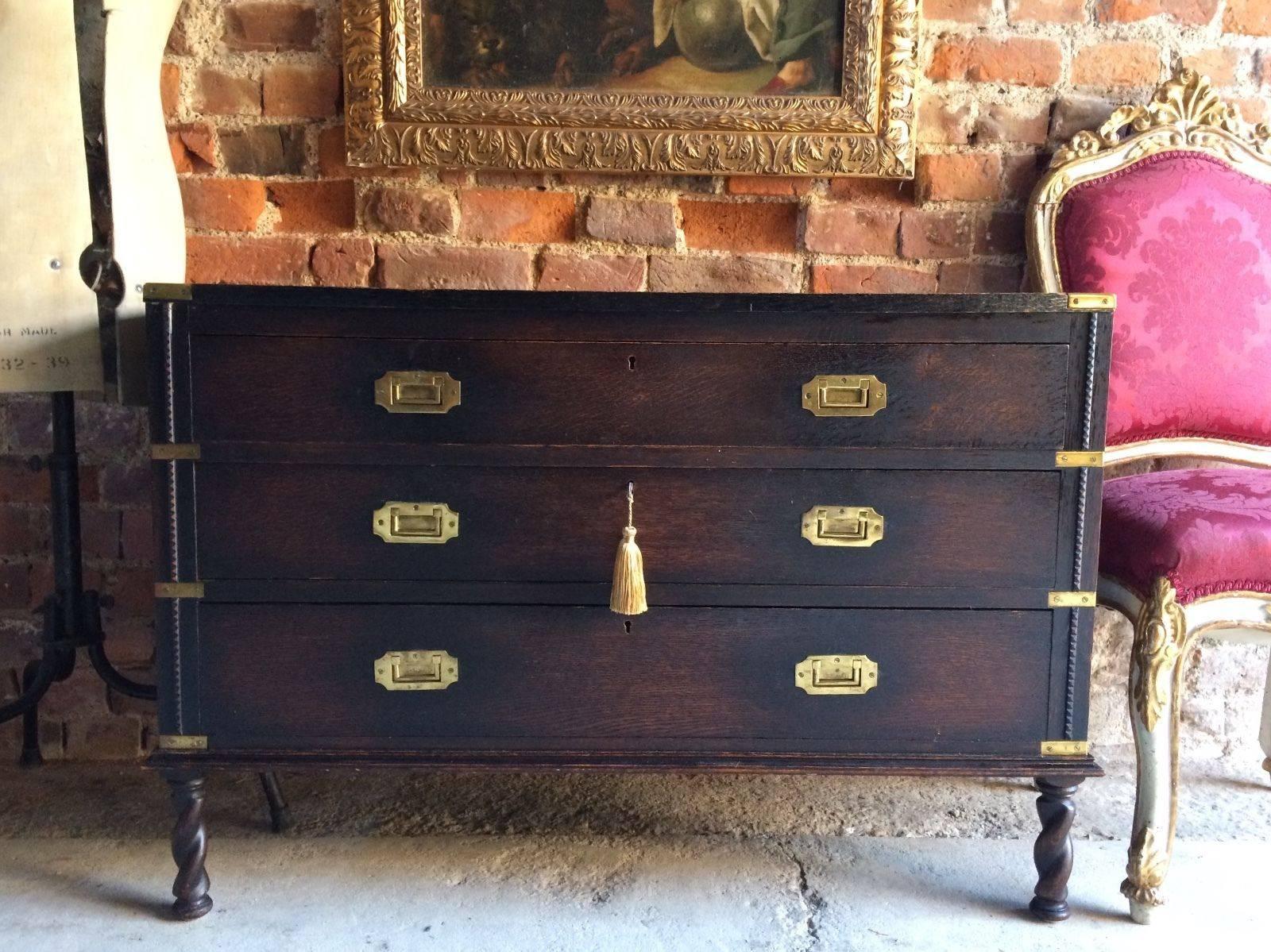 A beautiful antique Victorian Campaign style solid oak map chest of drawers, the rectangular top with tooled leather inset with brass corner sections over three long graduating drawers all with original brass inset Campaign style handles raised on