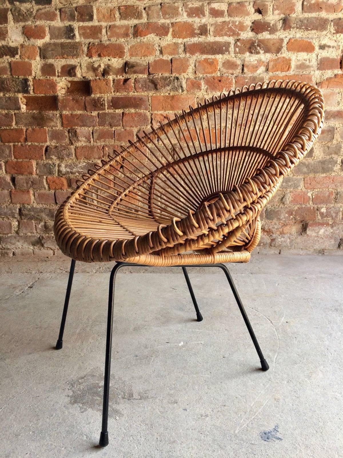 Stunningly beautiful Mid-Century 'Sunburst' rattan chair attributed to Franco Albini or sometimes Janine Abraham circa 1950s, fabulous deep bucket seat with open loop back, raised on black iron base, offered in excellent completely original