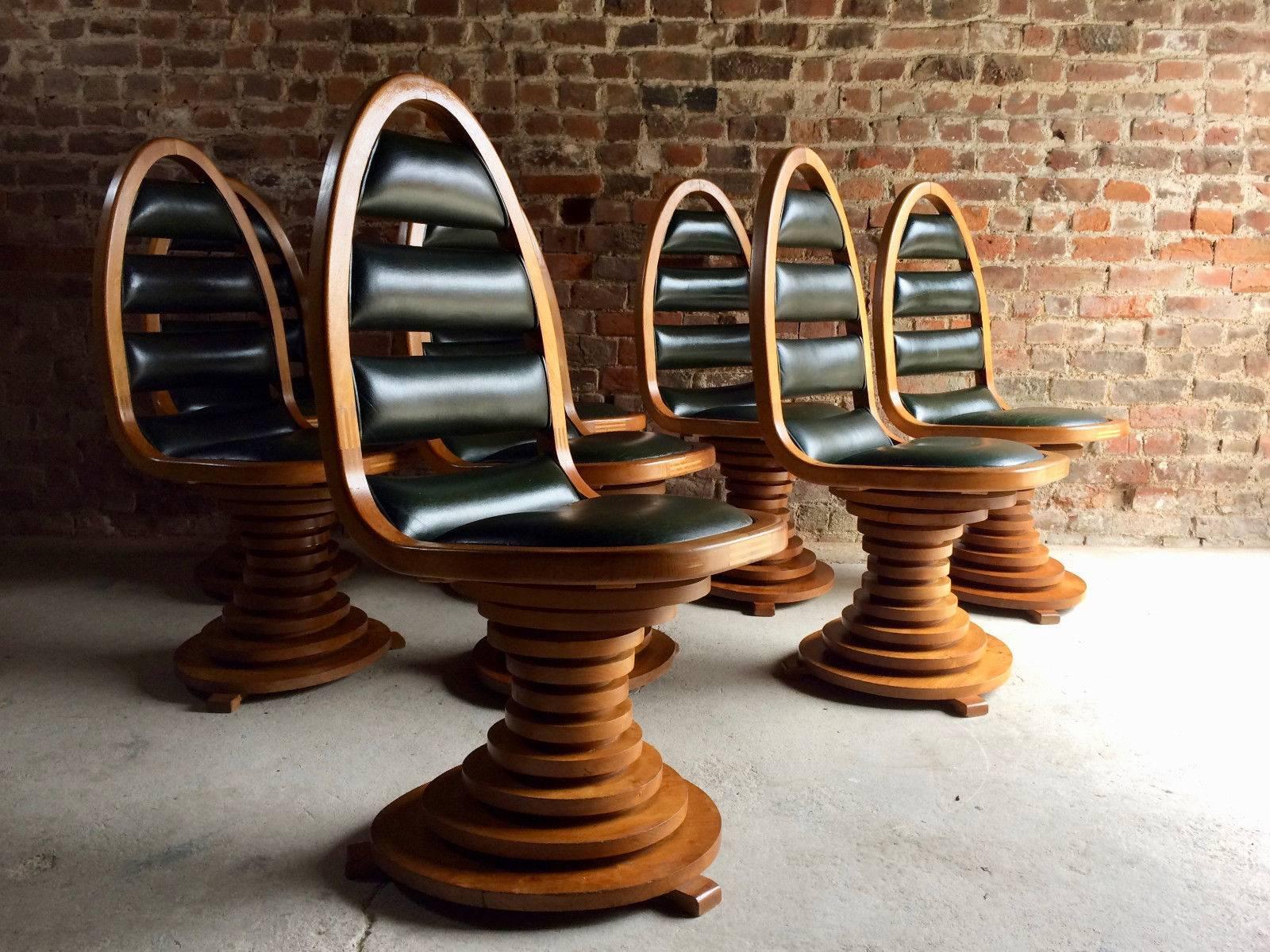 A quite stunning bespoke (probably one of a kind) mid-20th century ovoid form solid ash dining table in the manner of Carlo di Carli and a set of eight matching solid Ash and leather chairs, circa 1960s, the table with its large oval form top with a