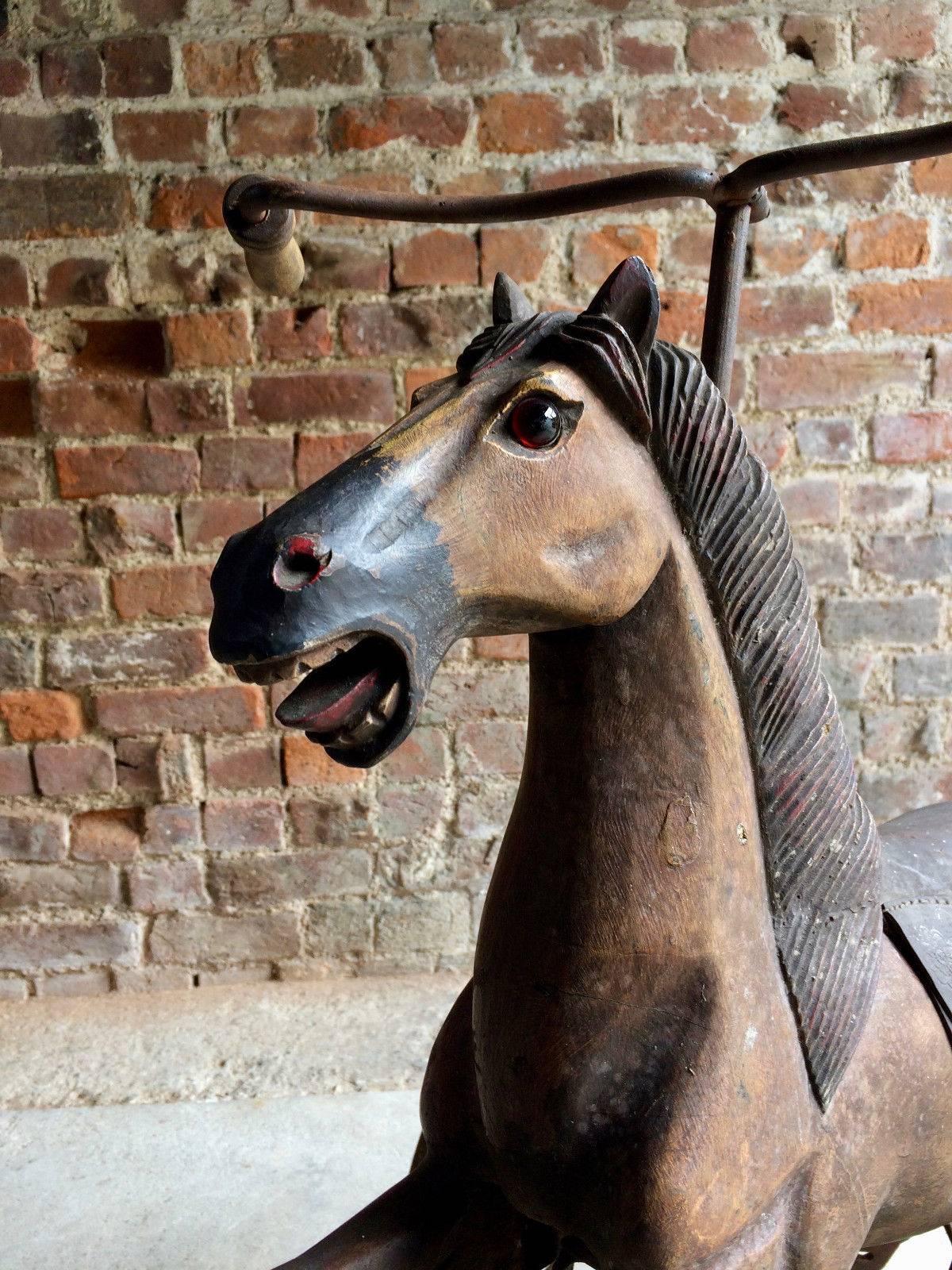 A fabulous vintage velocipede style wrought iron and carved wood child's tricycle in the form of a horse, extremely handsome with lots of age and charcter, looks amazing!