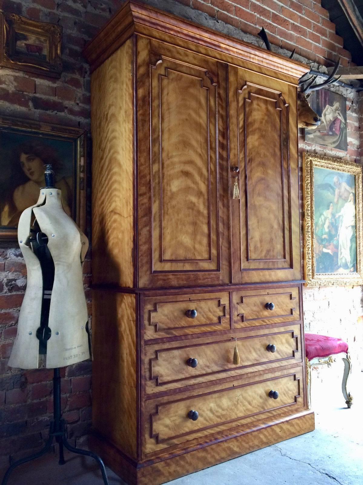 Antique W. Bertram of soho satin birch linen press over chest, circa 1870

Description:

A stunning antique 19th century Victorian satin birch clothes press by W. Bertram of London circa 1870, the top with a moulded cornice above two panelled
