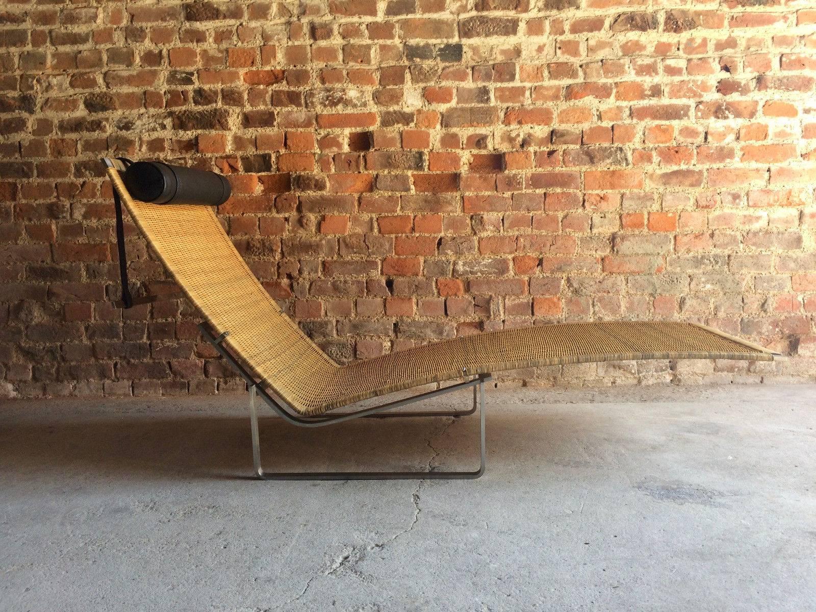 A magnificent 'right on trend' iconic designer lounger after Poul Kjærholm, a chaise longue lounger model no. PK24 designed by Poul Kjaerholm originally produced for the first time in 1965, this chair is composed of three elements, the brushed steel