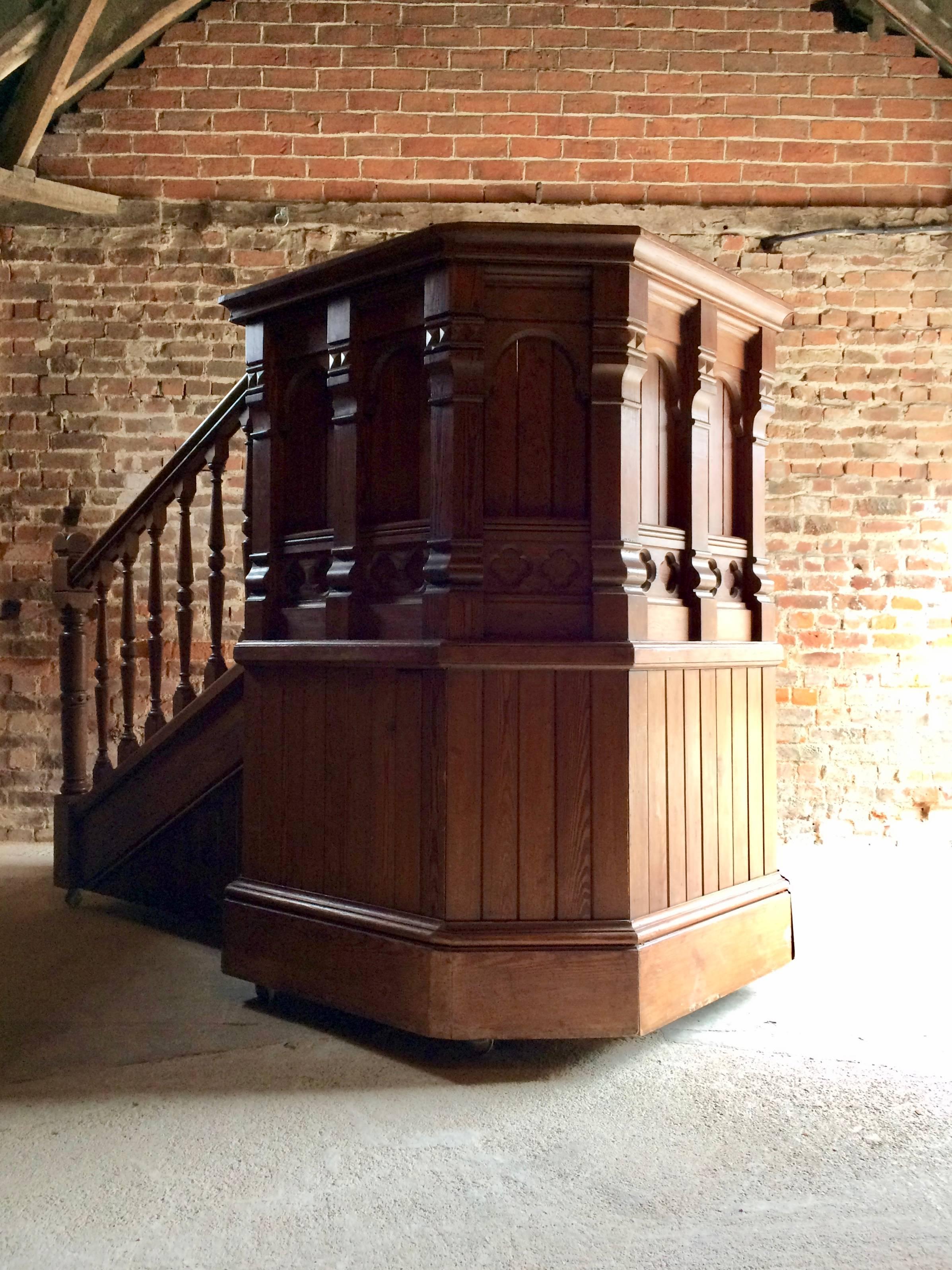 A stunning late Victorian early Edwardian pitch pine Gothic church pulpit with matching roll-away stairs, both the pulpit and stairs are on casters making moving easier, a seriously grand piece of furniture that is ideal for a club or bar and is