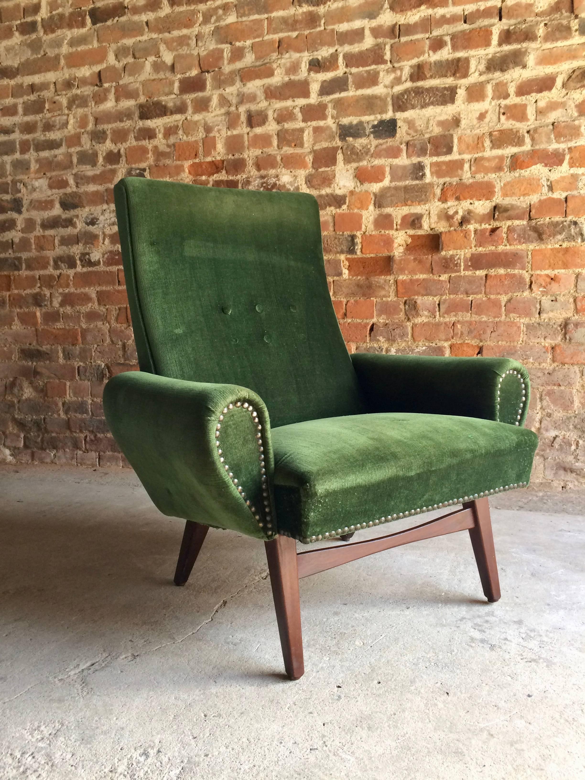 A stylish Mid-Century Danish green velour-type high back armchair on teak splayed legs, circa 1950s, legs with some minor marks and wear, upholstery faded and minor burn marks, would benefit from being reupholstered, personally I think it looks