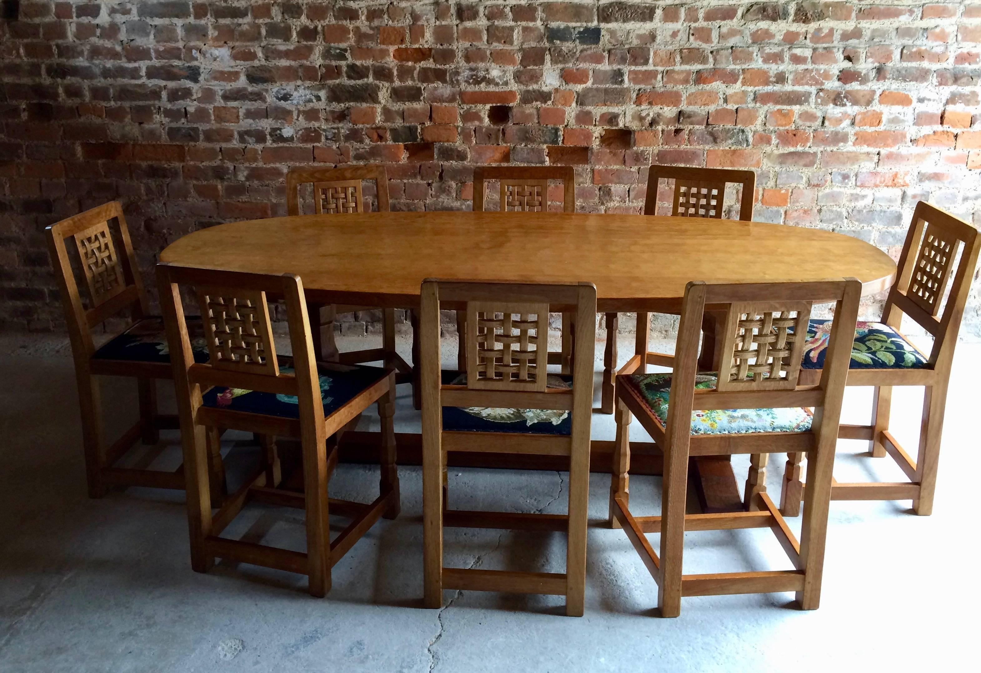 A magnificent Robert 'Mouseman' Thompson of Kilburn 'Light Fume' solid English oak dining table and Eight 'Mouseman' chairs, the refectory table seats eight people in comfort, with plenty of room for place settings, table decorations and candles,