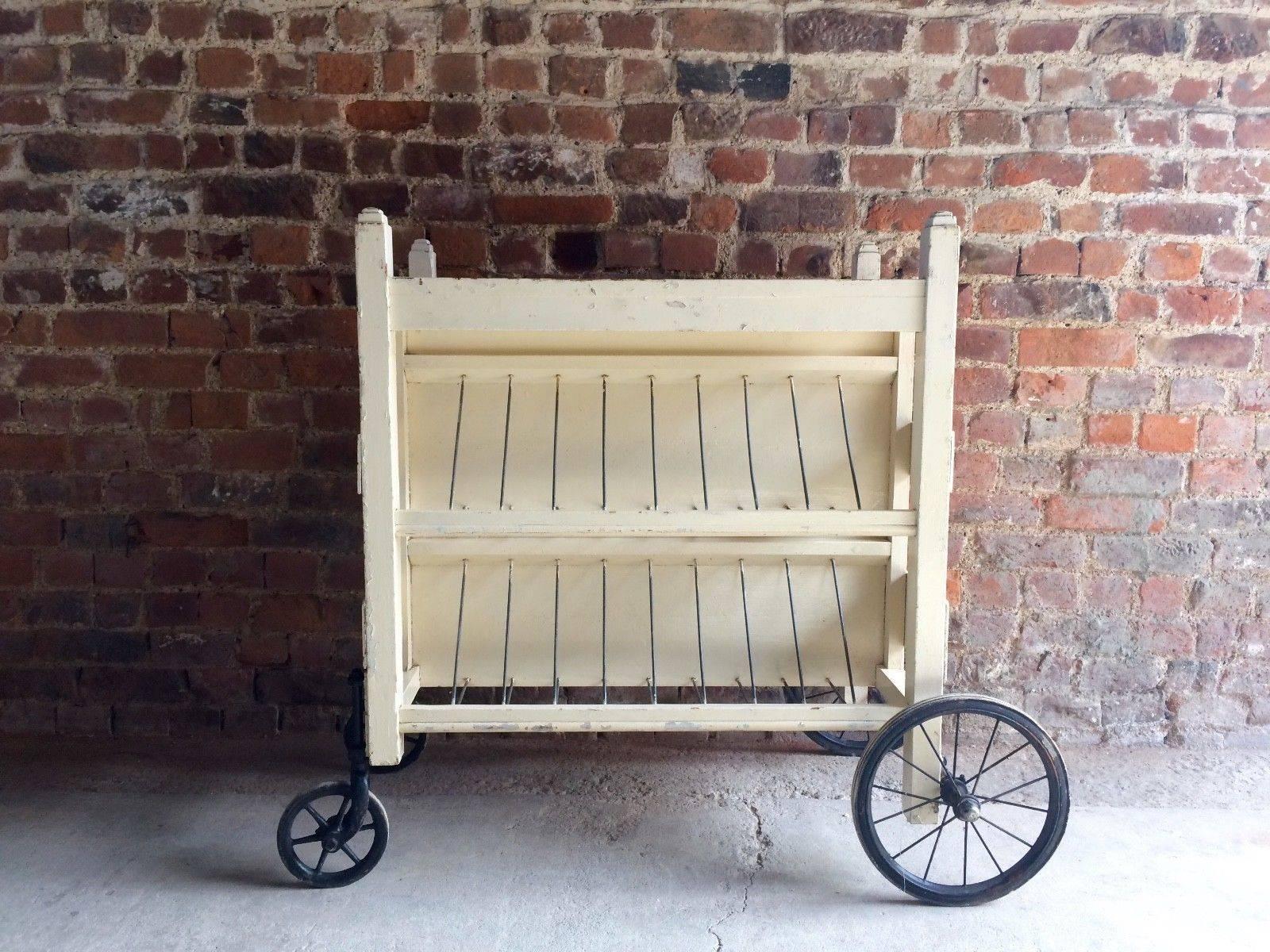 A stunningly beautiful 20th century scratch built former prison library trolley in white
paint, with vintage wheels and wire racking, offered in great vintage condition knocks
and marks adding to the overall character and charm of the piece, looks