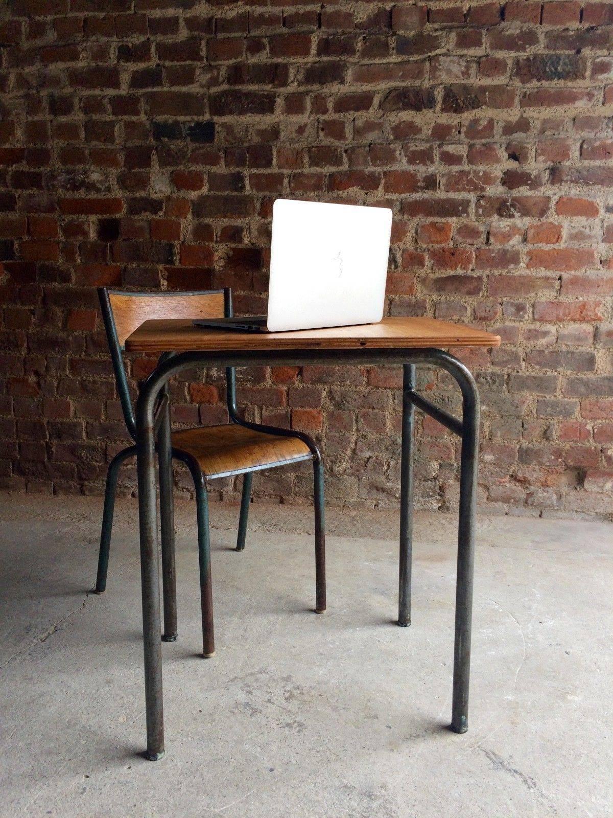 A stunningly beautiful small metal framed child's school desk of French origin. The desk 
has tubularmetal frame, dating to the 1970s. The desk is accompanied by a matching chair. Both offered in great antique condition, with marks adding to the