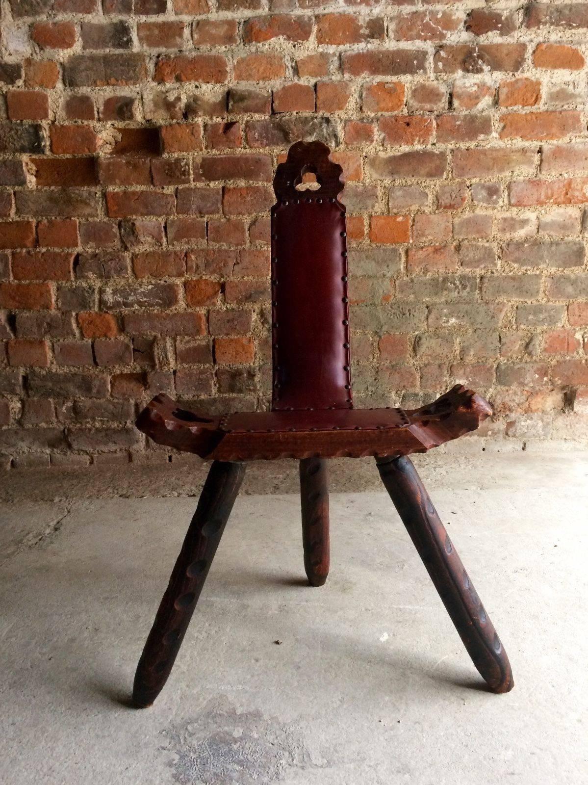 A Stunning small late 19th century three legged gypsy manor stool, having noggin legs, carved back with studded leatherette finish, looks amazing.