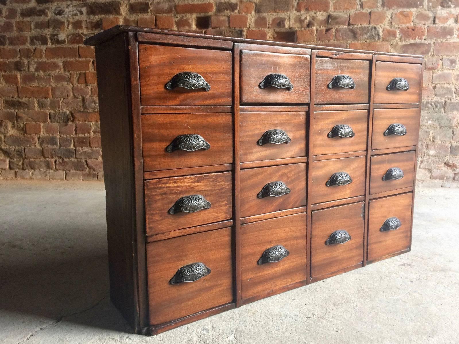 Fabulous antique 19th century mahogany Haberdashery chest of 16 drawers with shell cup iron handles.