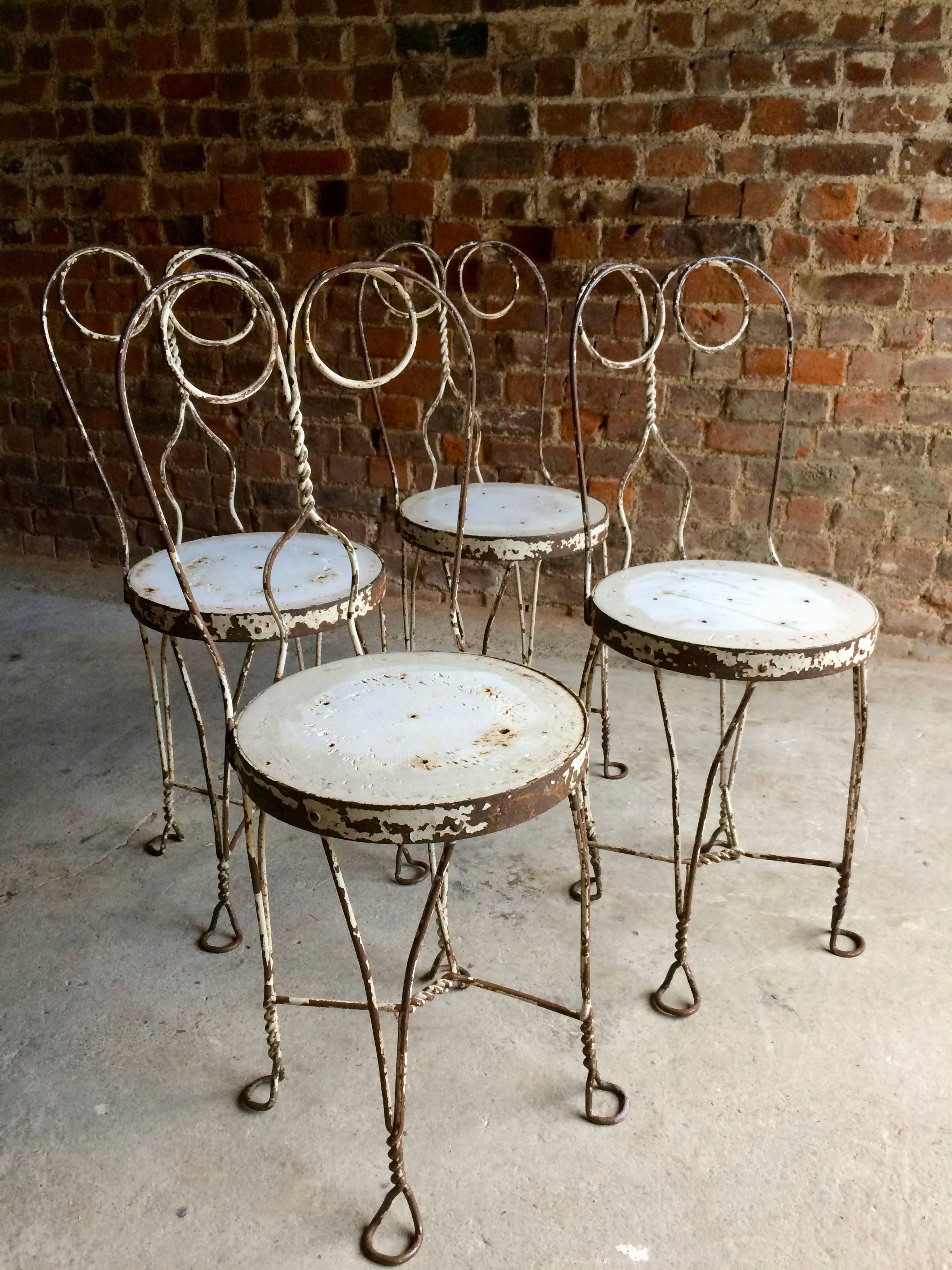 Early 20th Century French Bistro Table and Four Chairs Original Wrought Iron, circa 1920s