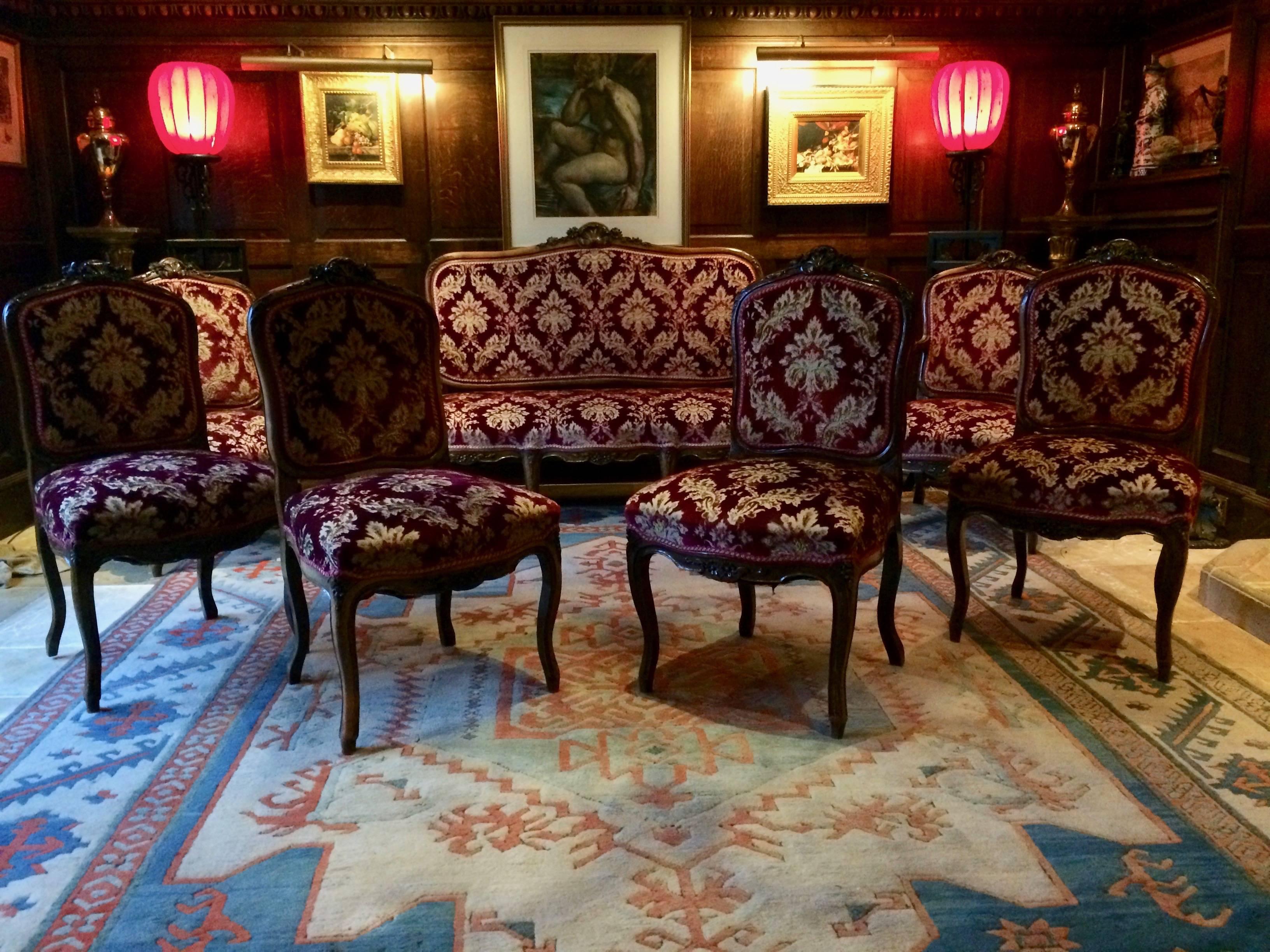 A stunning 19th century Victorian mahogany lounge suite with showood frames, the backs and seats upholstered in damask, comprising a canape, pair of armchairs and four side chairs

Antique
19th century
Salon suite
Seven pieces
Canape sofa
Two