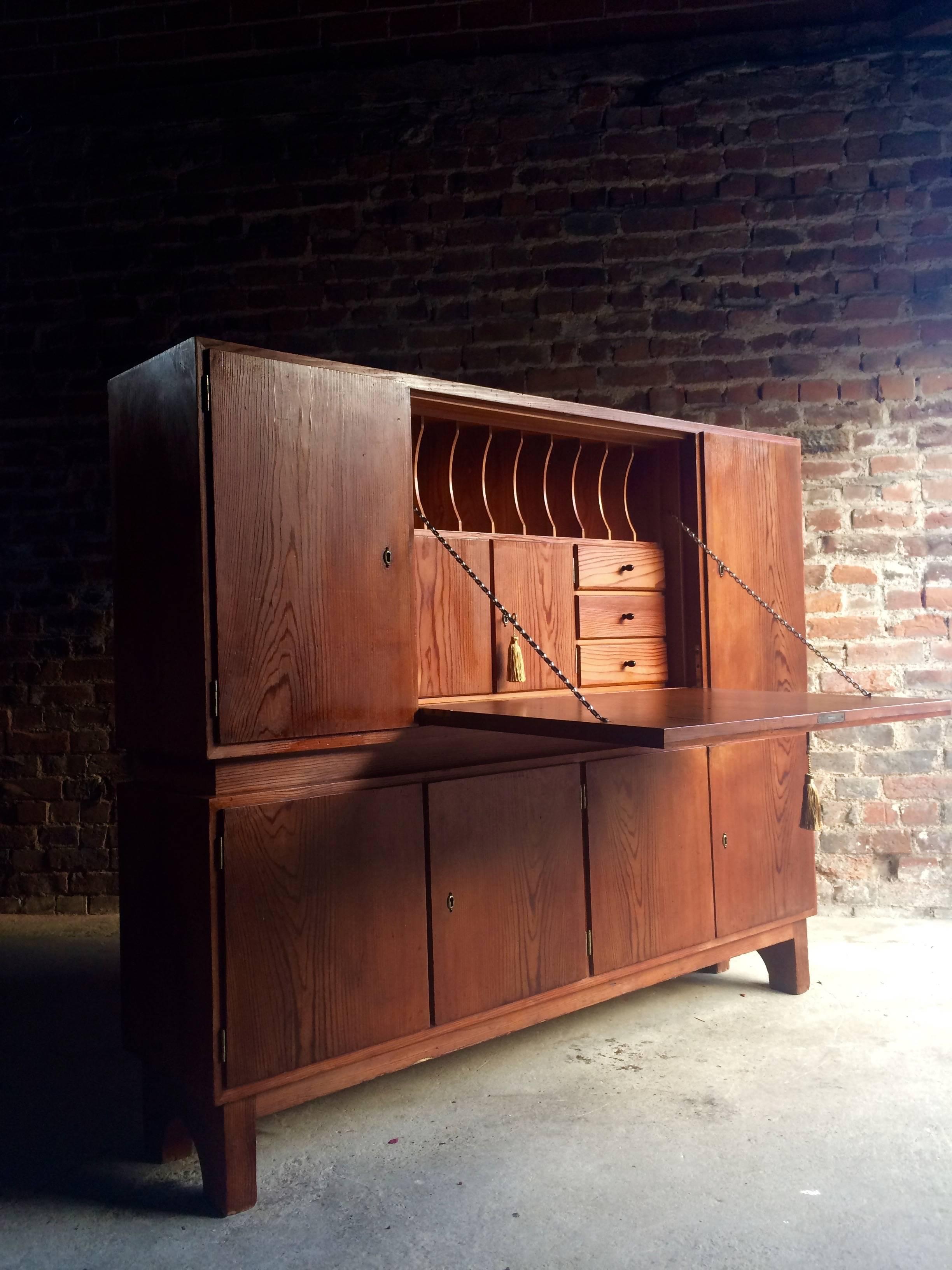 A beautiful midcentury extremely rare and unique Czechoslovakian pitch pine office in one writing bureau cabinet, circa 1940. The cabinet having central section with fall front and a fitted interior with various compartments, flanked by cupboards,