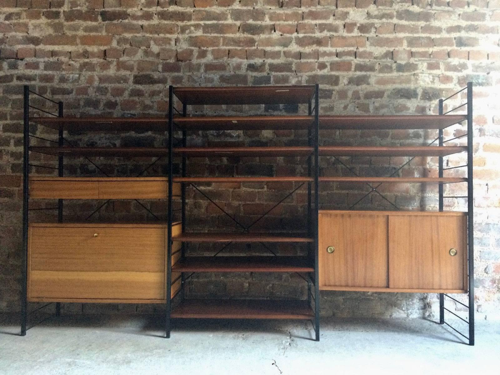 Fabulous midcentury Triple Ladderax style black metal and hardwood shelving unit, circa 1970s, completely dismantles and can be configured to any way you want.

Please note: that this item will be delivered completely dismantled.