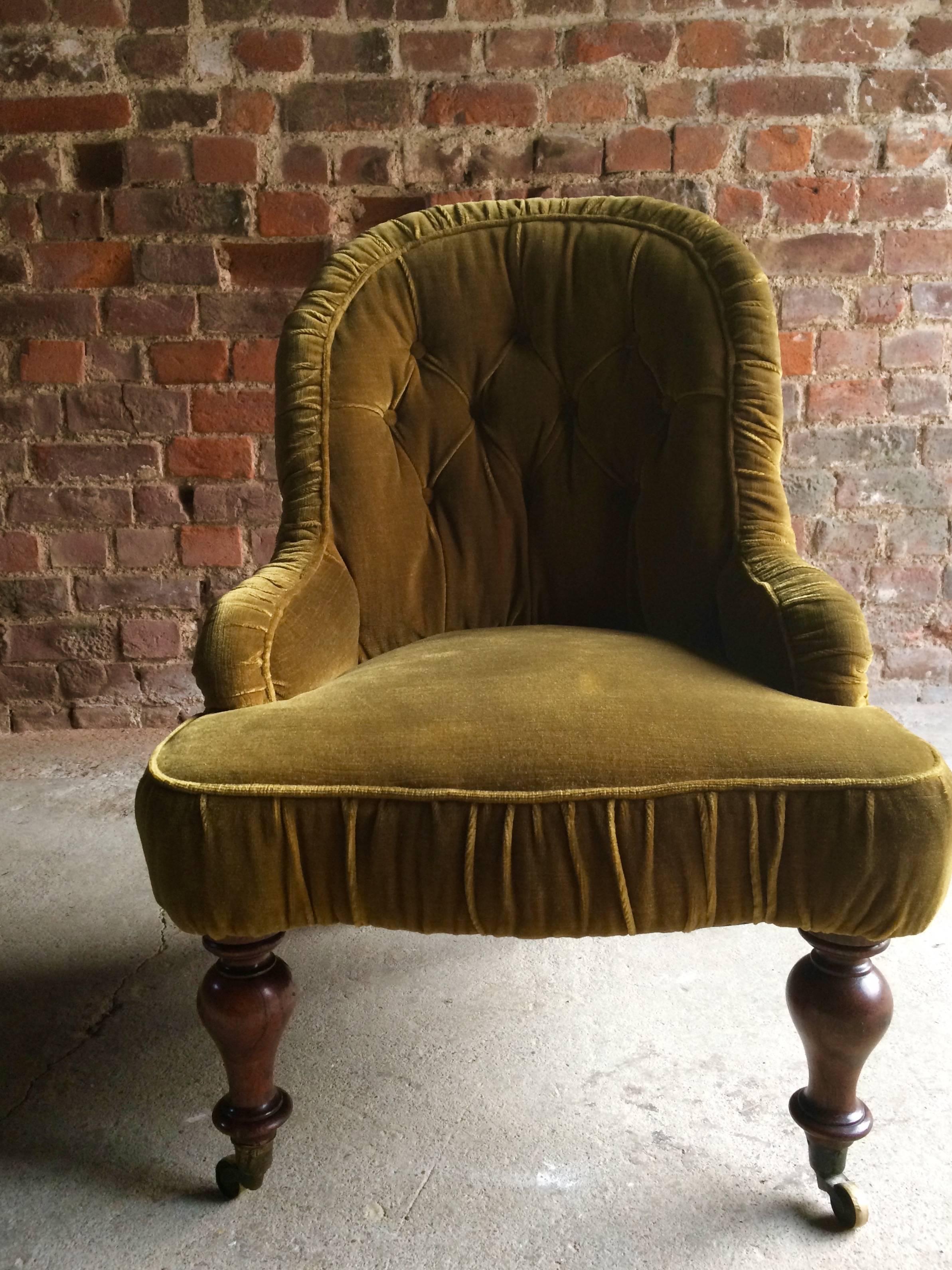 A magnificent antique late Victorian 19th century green fabric button back nursing chair, the chair raised on four rosewood legs with casters, extremely comfortable, there are no tears or rips to the fabric and the joints are all solid, looks