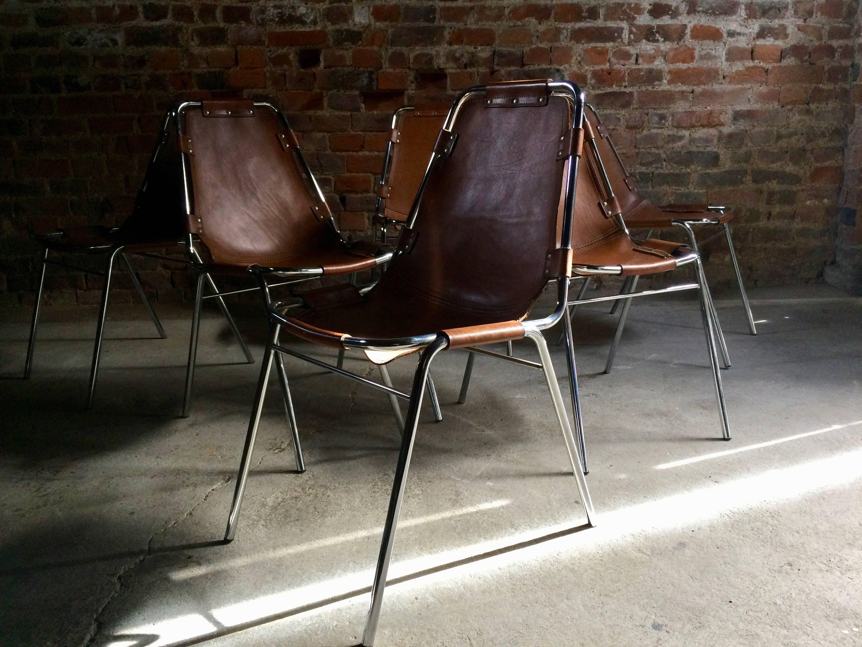 Original set of six tan leather 'Les Arcs' dining chairs designed by Charlotte Perriand for Cassina in the 1960s for the Les Arcs ski resort, each chair consists of a chrome tubular frame with brown leather seats, this set dates to the mid-1960s and