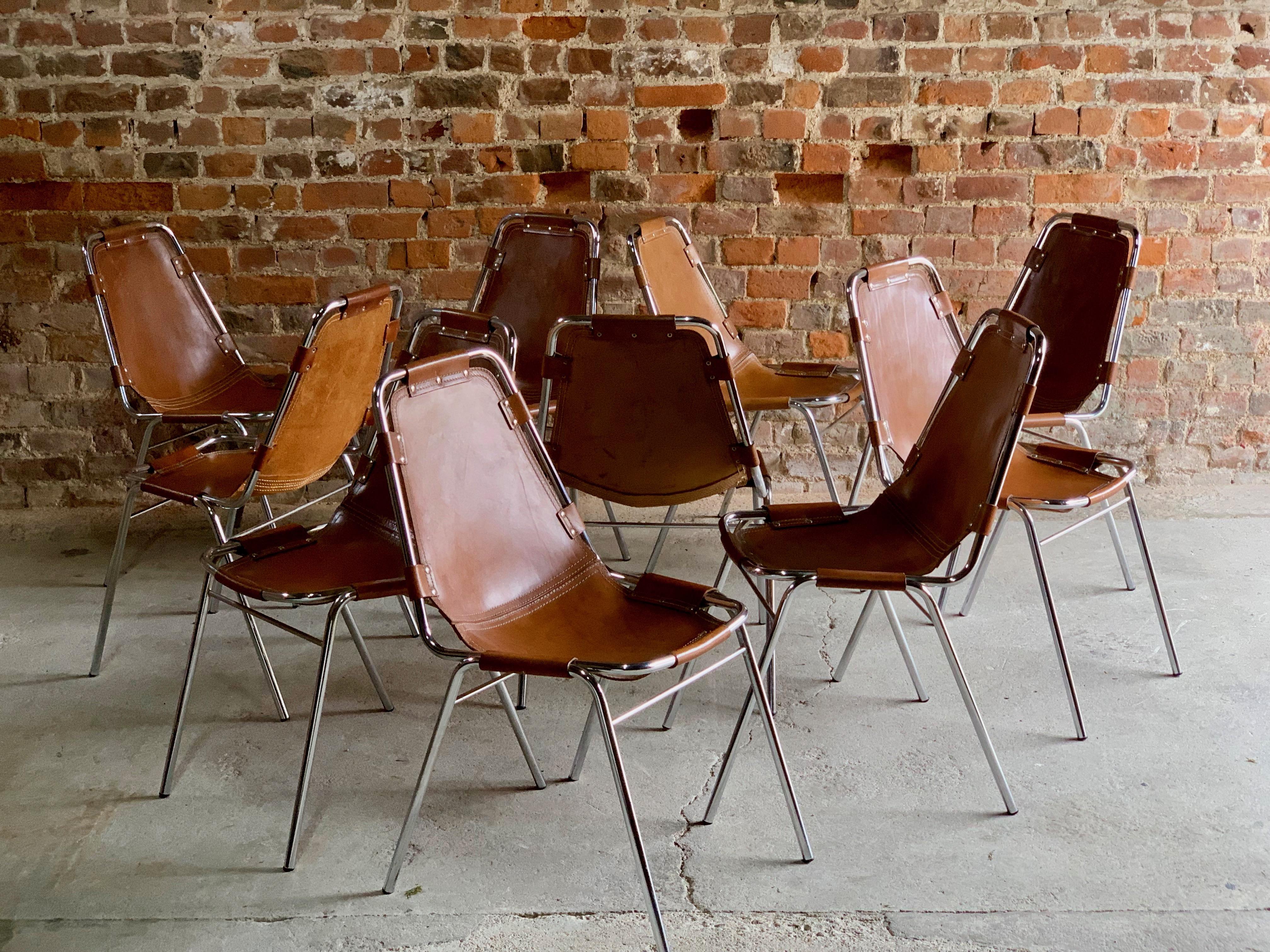 Original set of ten tan leather 'Les Arcs' dining chairs manufactured by the Italian firm, Dal Vera, and selected by Charlotte Perriand for the Les Arcs ski resort, each chair consists of a chrome tubular frame with brown leather seats, this set