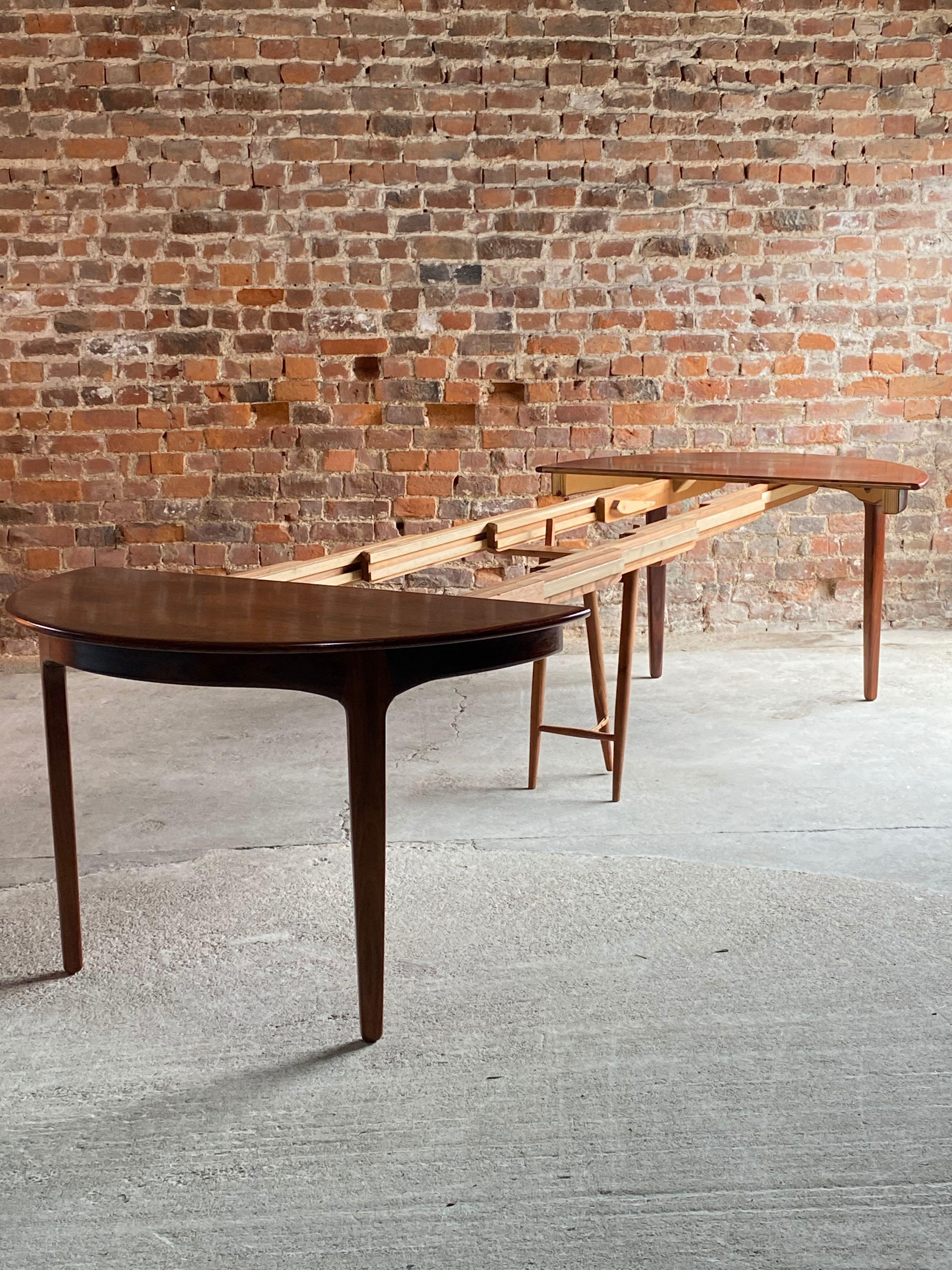 Henning Kjaenulf Brazilian rosewood dining table model 62 by Soro Stolefabrik, Denmark, 1962

Monumental Henning Kjaenulf by Soro Stolefabrik Brazilian rosewood dining table model 62, Denmark, 1962. This table extends from a four seater to a