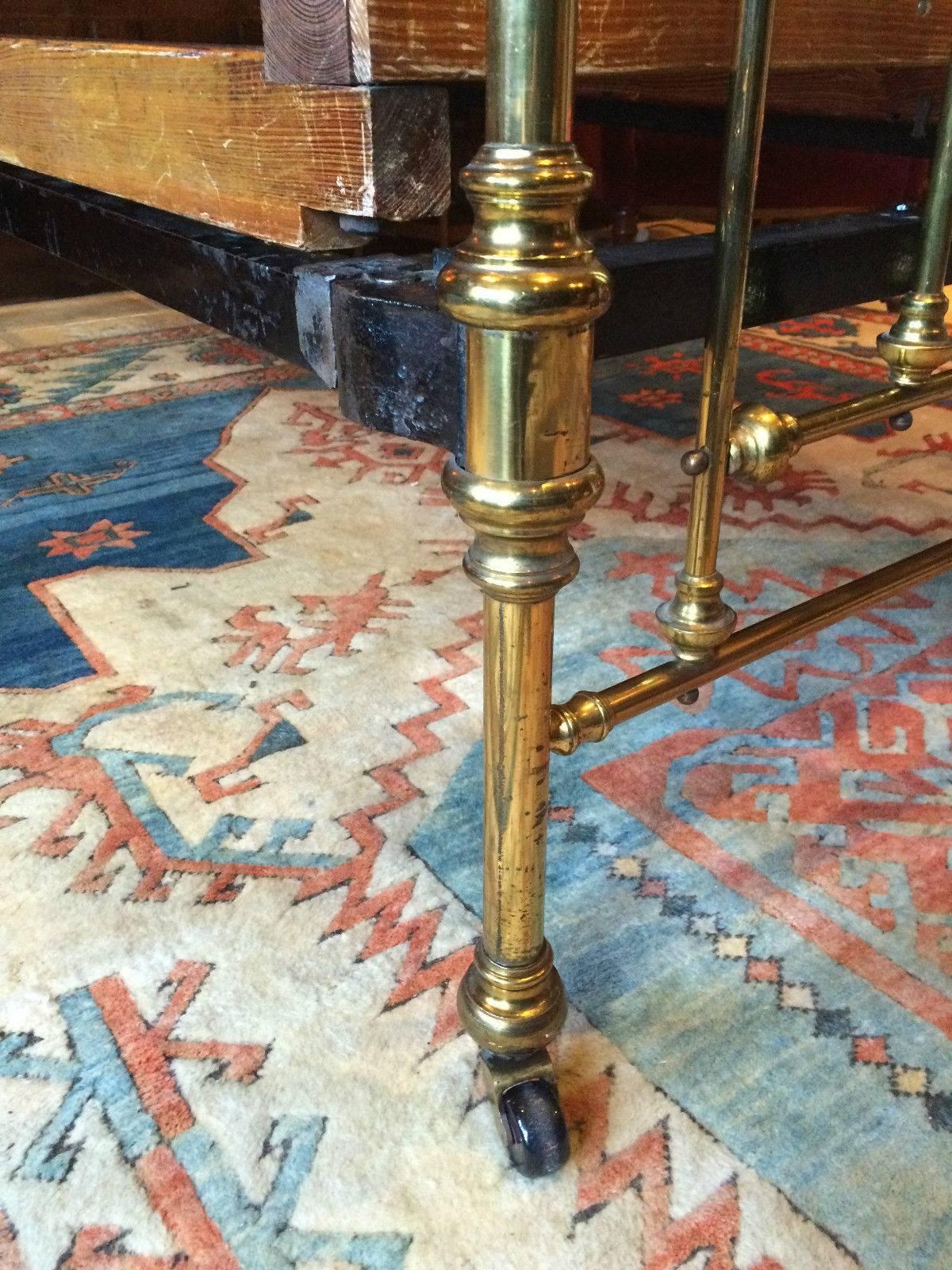 A beautiful late 19th century antique Victorian lacquered brass single bedstead of railed design, standing on ceramic casters together with woven spring base, looks amazing.