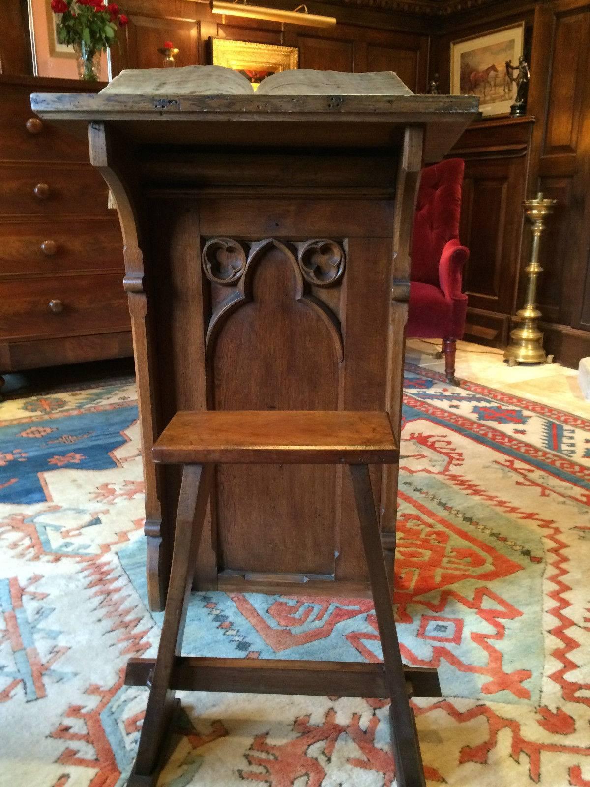 An original antique Victorian solid oak bible stand lectern with a matching stool, Gothic ‘Pugin' style carvings to the front, beautiful patina and offered in excellent condition.