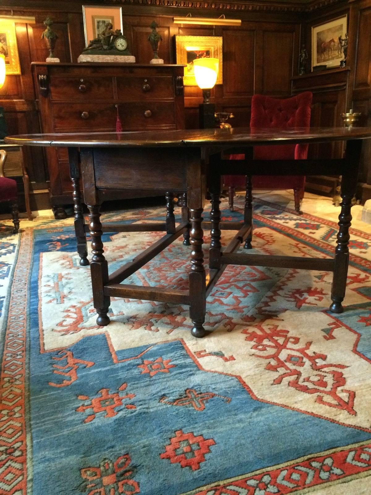 Antique 19th century George III solid oak oval dining table, seating up to eight people, raised on elegant barley twist legs, the table comes from a large Gloucestershire country estate .