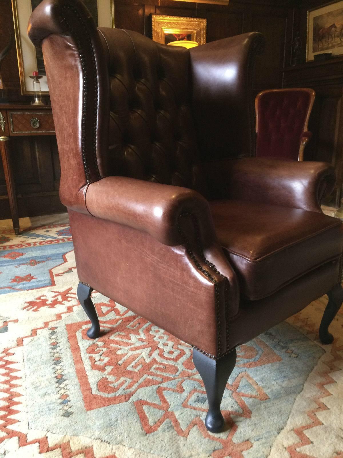 A beautiful almost as new Chesterfield style leather wingback button-back armchair, upholstered in sumptuous brown leather, standing on four cabriole legs, the chair is offered in excellent almost new condition.