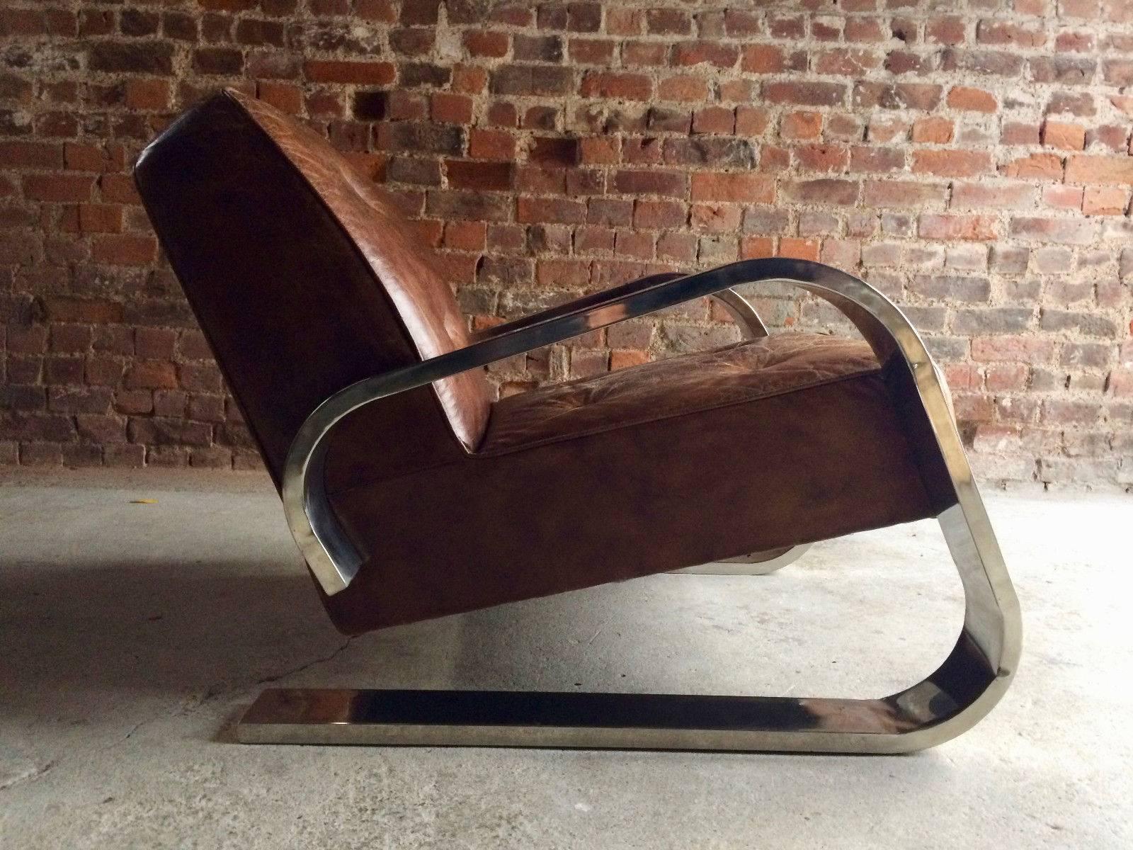 A stunning contemporary Alvar Aalto design 400 Tank armchair, raised on chromed frame with brown buttoned leather upholstered seat and backrest, the chair is offered in superb condition and has had very little use, the leather with a lightly