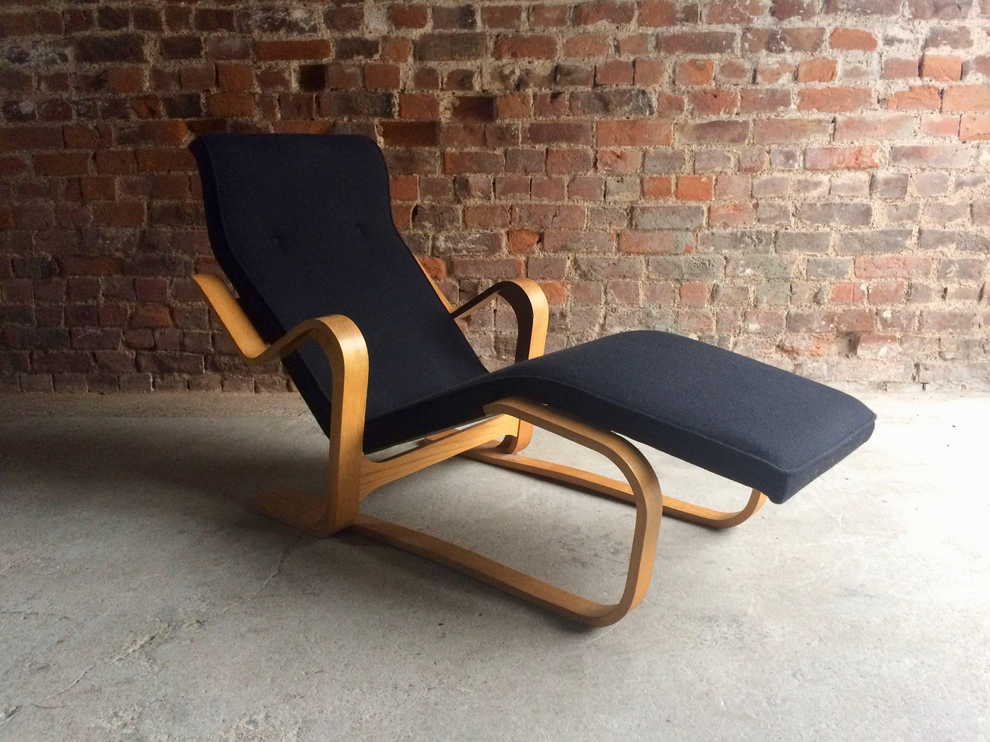 Original Marcel Breuer bent ply 'Long Chair' with black seat pad, circa 1970s, the ‘Long chair’, with its bent frame of laminated birch wood supporting the shaped timber seat and back, was developed soon after Marcel Breuer settled in England in