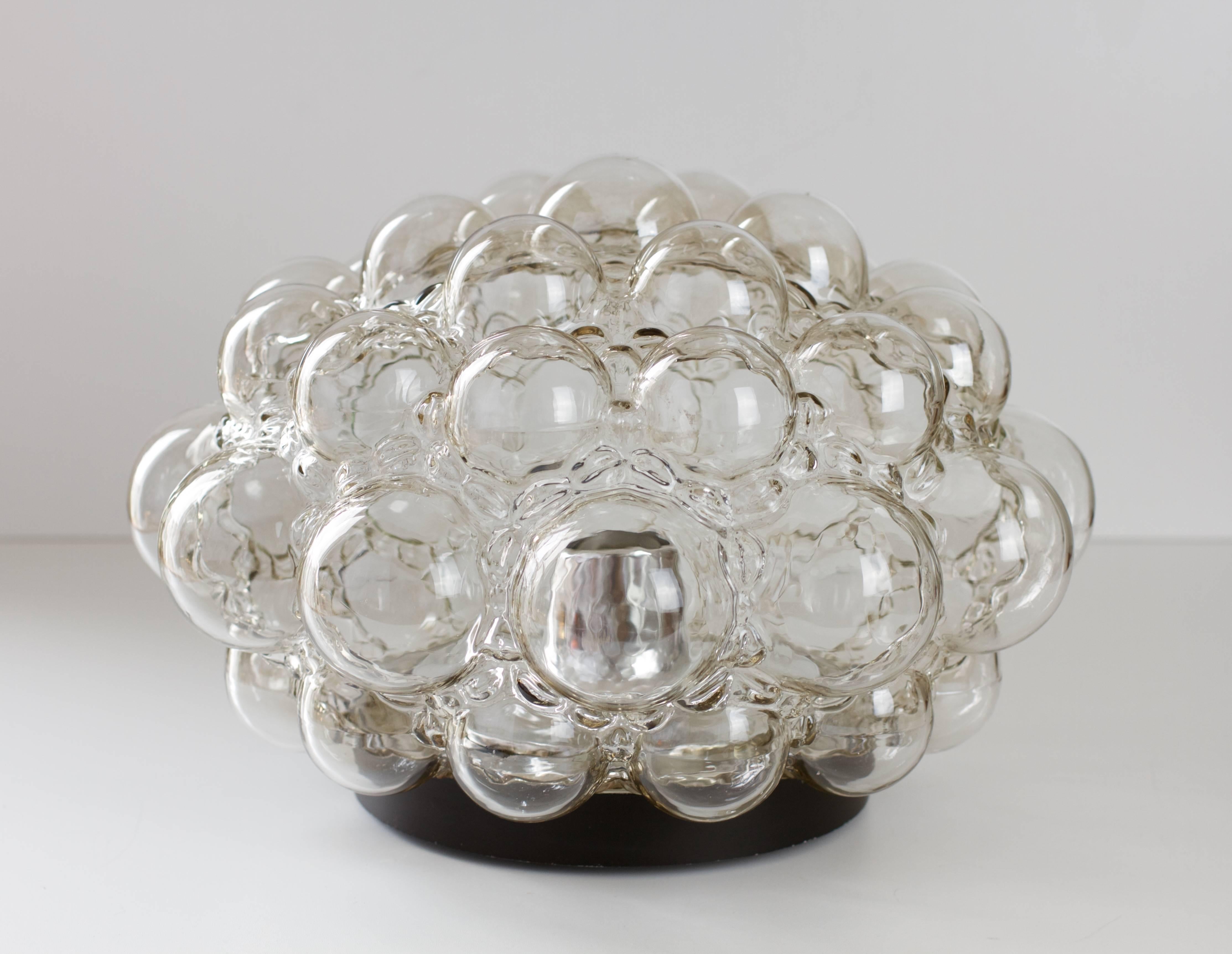 A beautiful large and vintage Mid-Century smoked / grey colored / colored bubble glass flush mount light fixture / sconce designed by Helena Tynell for Glashütte Limburg, Germany in the late 1960s-early 1970s. This is the largest version produced