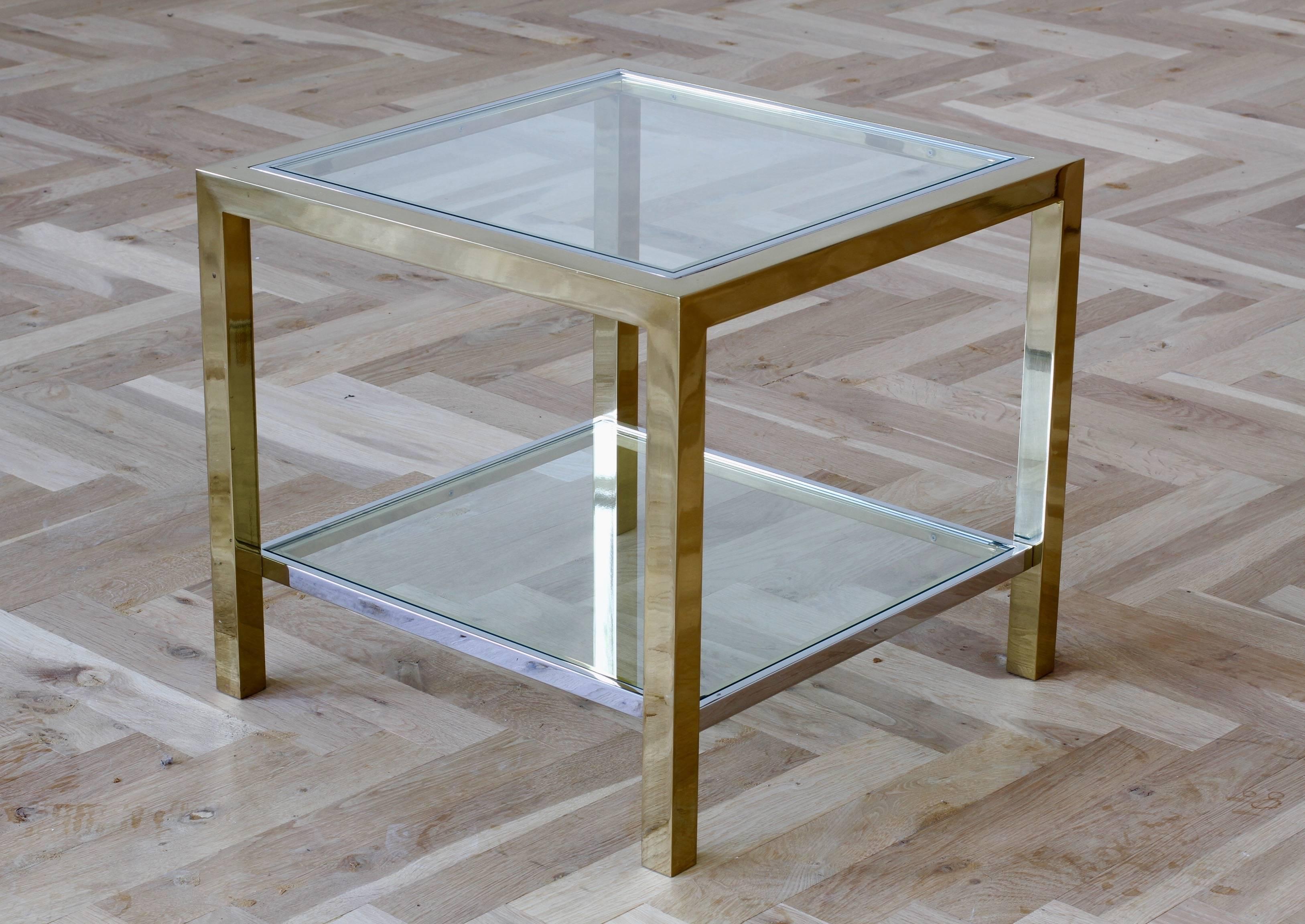 A stunning two-tiered brass and chrome-plated side or end table by Maison Jansen, circa 1970s. Perfect for the Hollywood Regency style enthusiast or Mid-Century lover although, this table would sit very well indeed within any contemporary home Decor