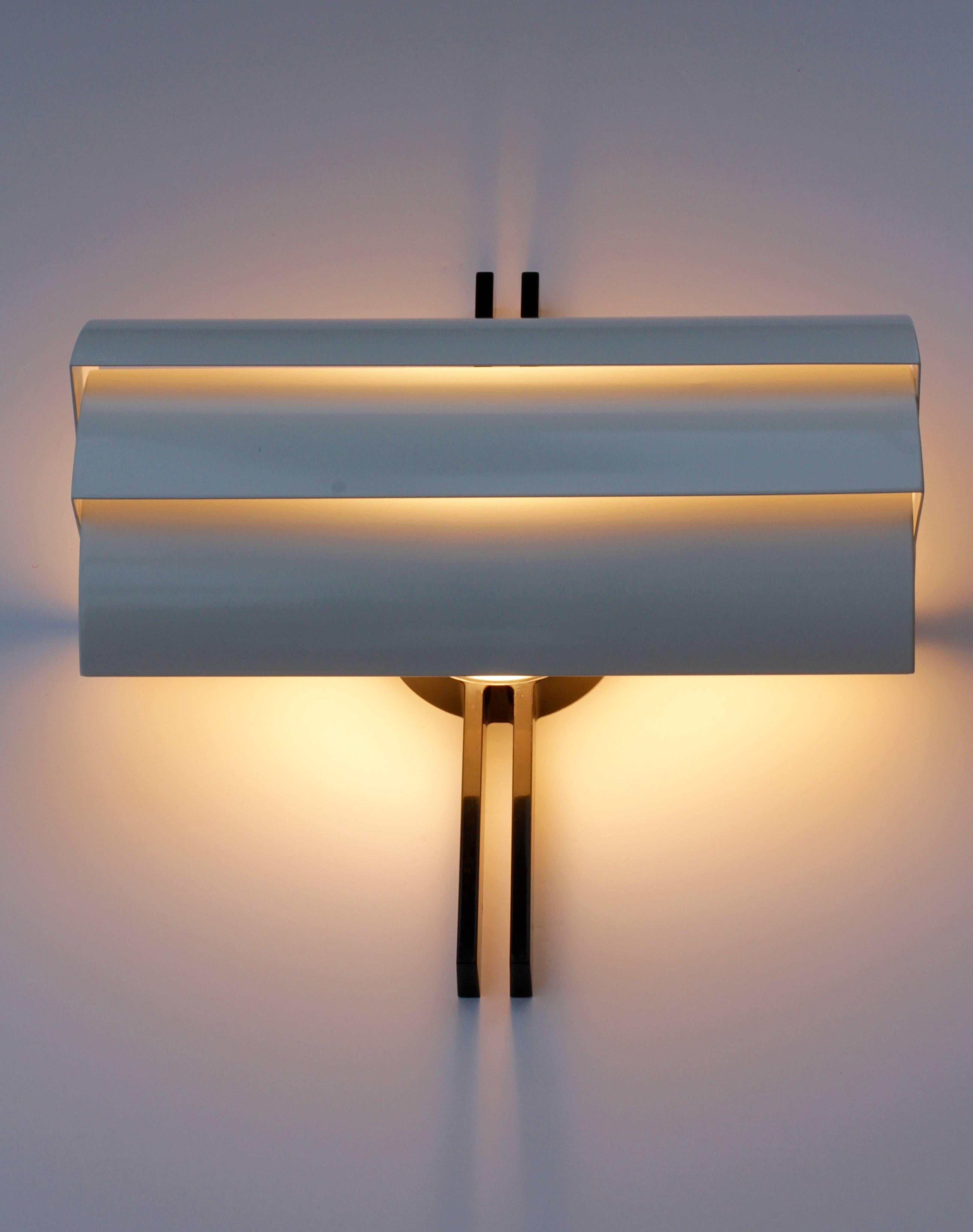 One of a pair of stunning and large wall-mounted lights, lamps or sconces designed for Artemide by Ernesto Gismondi, circa 1980s. Featuring three independently adjustable white metal shades giving you the ability to direct the light wherever you see