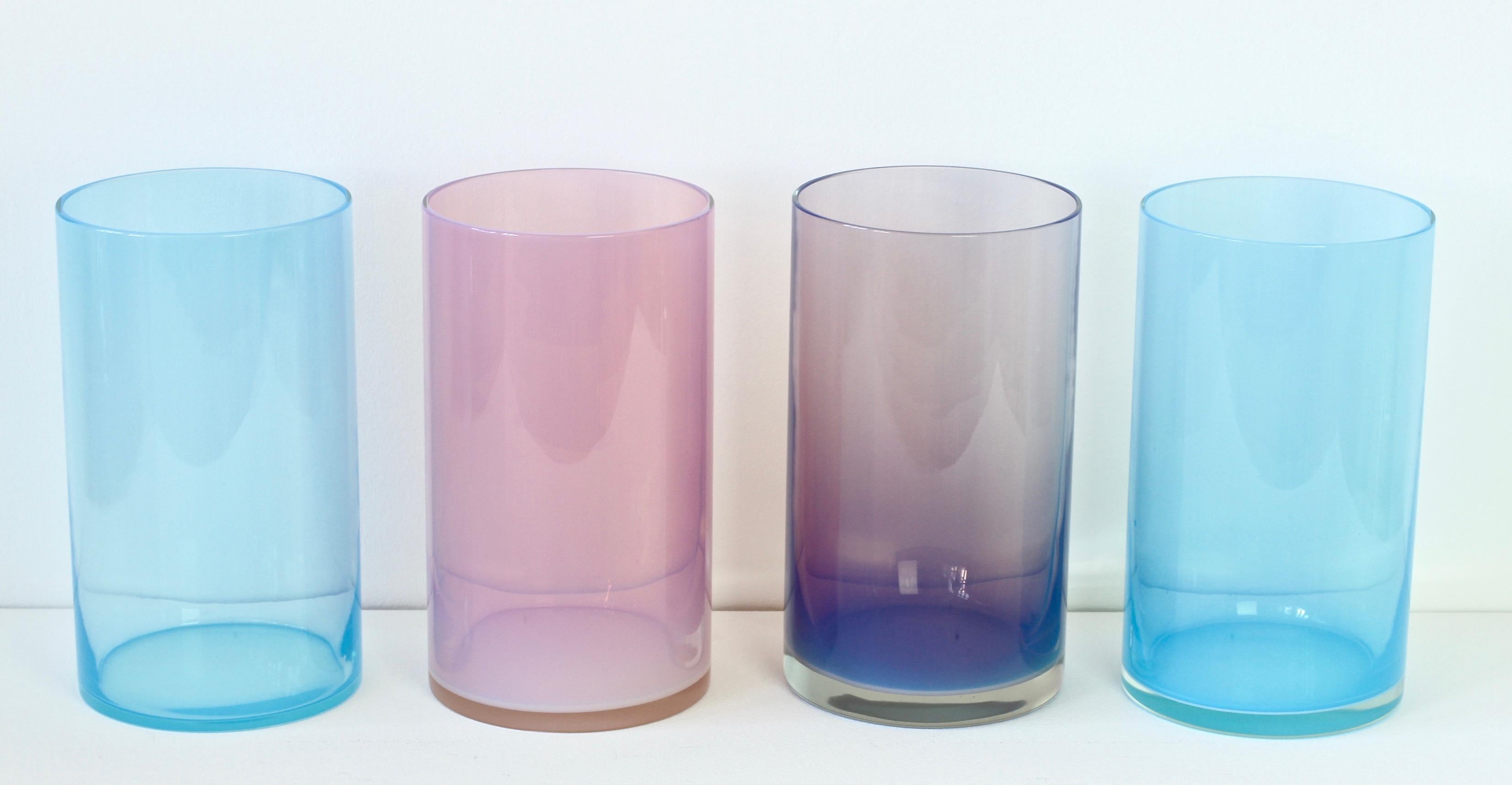 Signed midcentury, vintage set or ensemble of four 'Opalino' Murano glass vases or vessels designed by Antonio da Ros for Cenedese, circa 1970-1990 Wonderful translucent colors (colours) of vibrant blues, aubergine and pink. Simplistic yet elegant