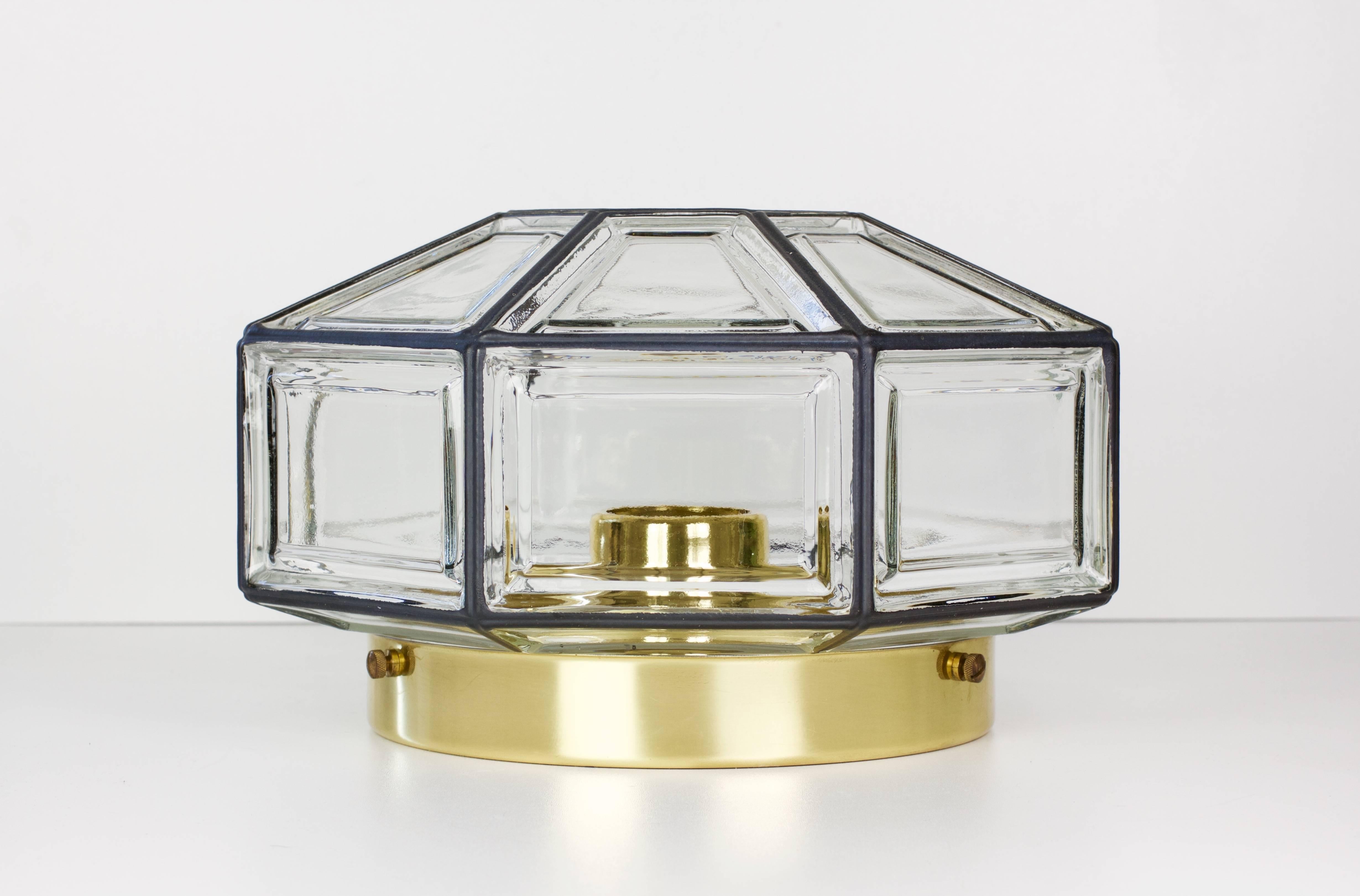 Octagonally shaped, minimalist German made flush mount light fixture produced by Glashütte Limburg circa 1965. This Art Deco and lantern style Plafonnier casts a fantastic light when mounted on the ceiling or wall and used with a gold crowned