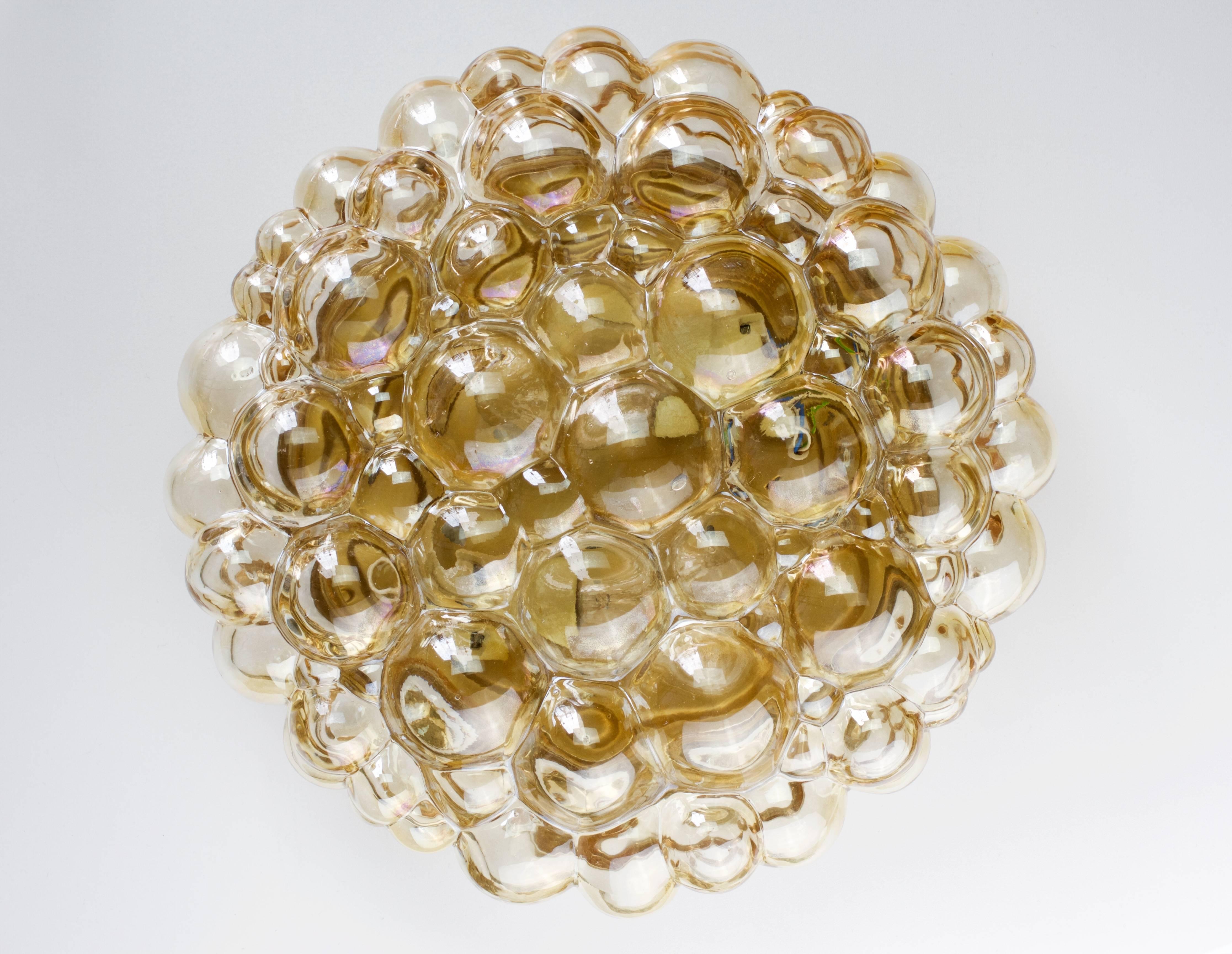 Stunning and large vintage pair of German made bubble glass flush mount lights designed by Helena Tynell for Glashütte Limburg in the early 1960s. Featuring beautiful Amber / Champagne colored / coloured glass it warms up any heart, mind or