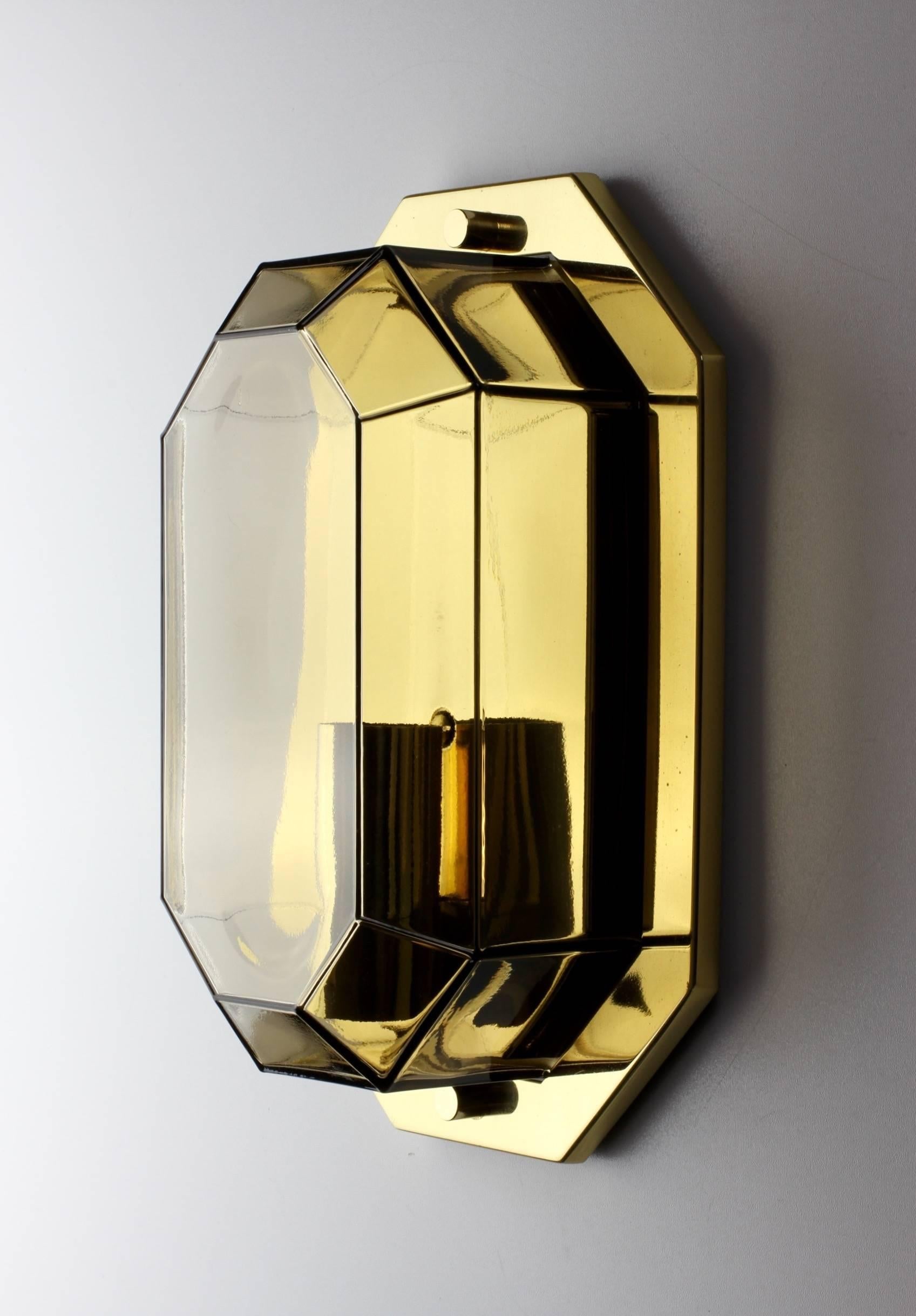 One of four stunning and elegant vintage Lozenge shaped wall lights by Glashütte Limburg, circa 1975-1985. Featuring geometric shaped mouth blown smoked or tinted glass elements with polished brass cases or mounts.

Wall-mounted with flush mounts,