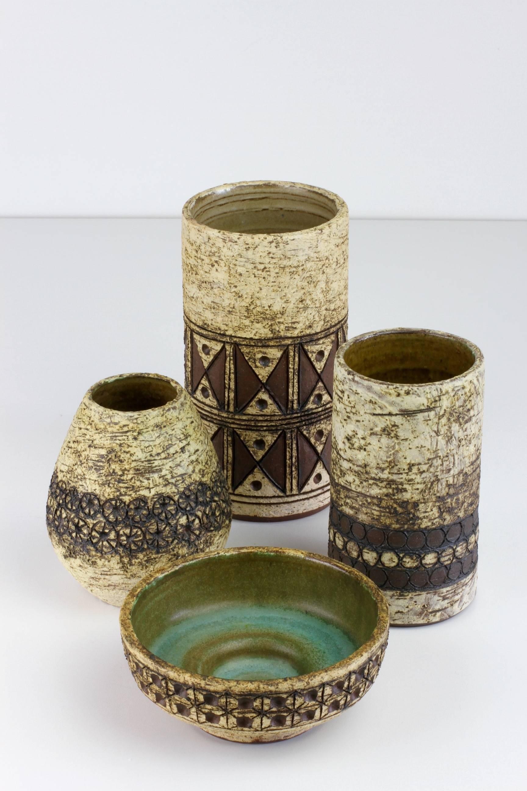 Absolutely stunning little collection of hand thrown, organically shaped and textured pottery including cylindrical vases, vessels and a bowl or dish. At first glance it is easy to mistake these works as Danish in origin but, they are by German born
