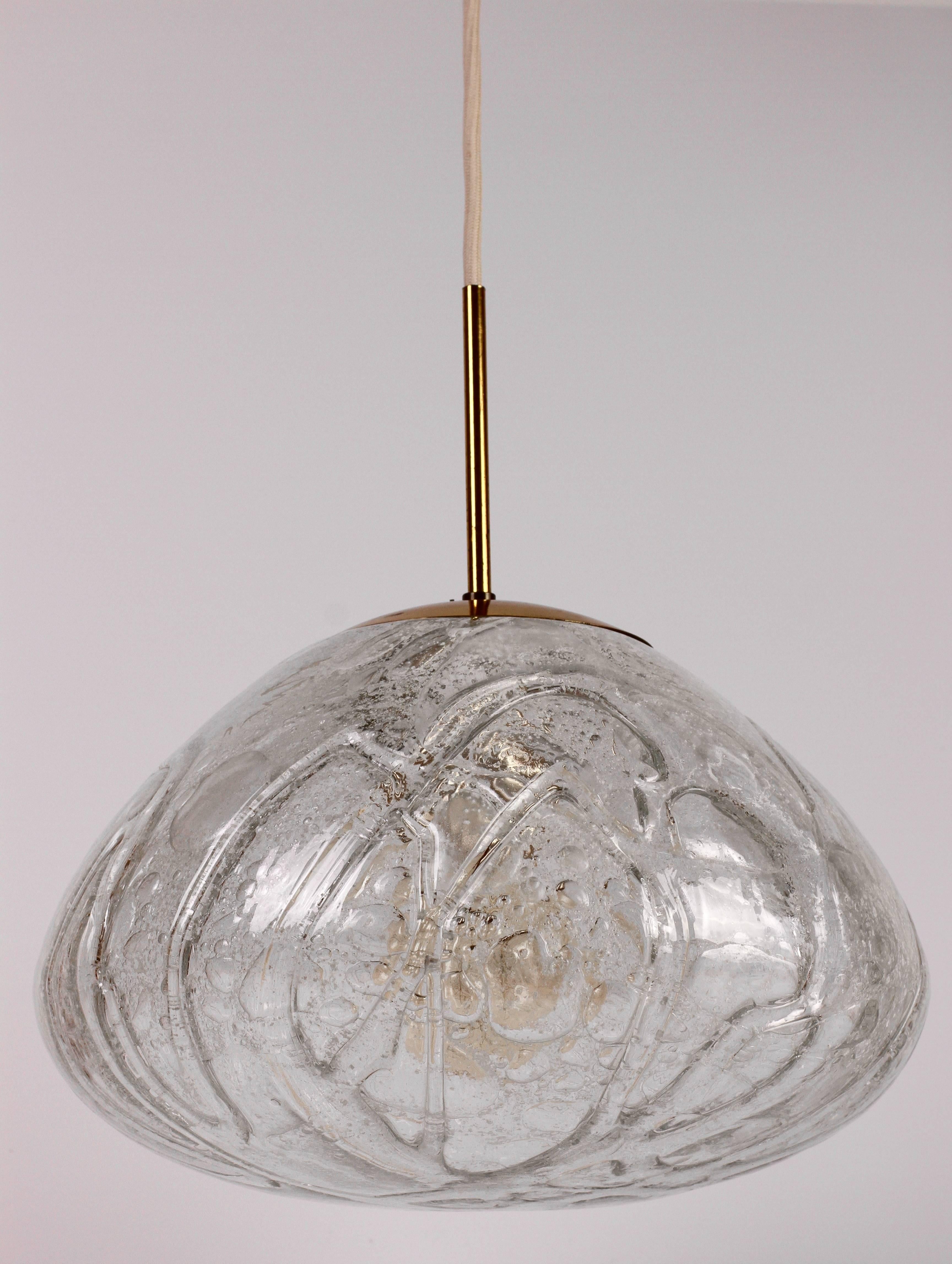 This beautiful Mid-Century glass pendant light by Doria Leuchten, Germany. Made in the later half of the 1950s to early 1960s, this gorgeous pendant features wonderfully made, mouth blown Murano glass which looks like melting ice.

 Newly re-wired