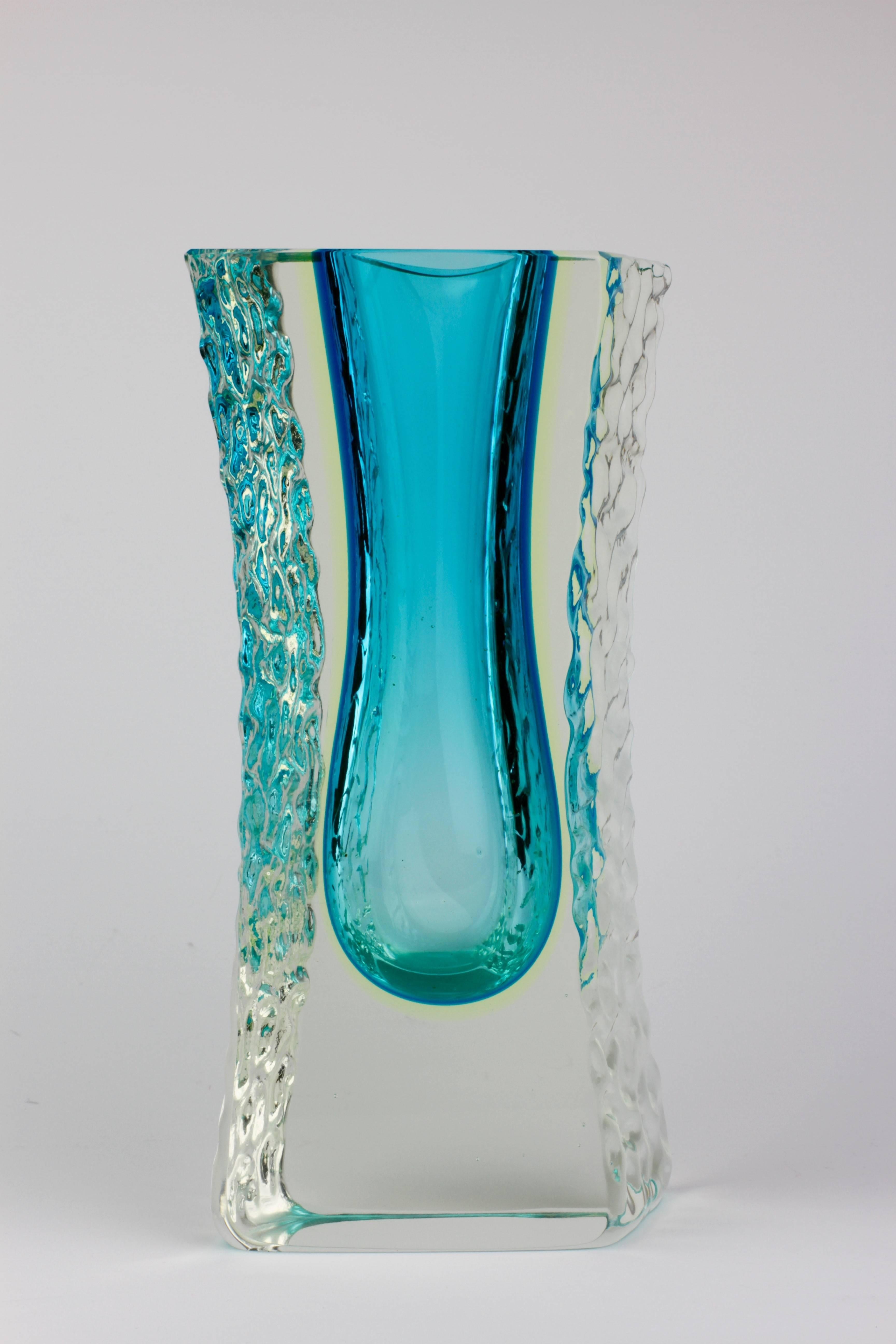 A beautiful Mid-Century Murano art glass vase attributed to Mandruzzato, circa 1980s. The combination of ocean blue and the textured clear 'Sommerso' ice glass looks simply stunning.

This is a rare color and size - a must have for any