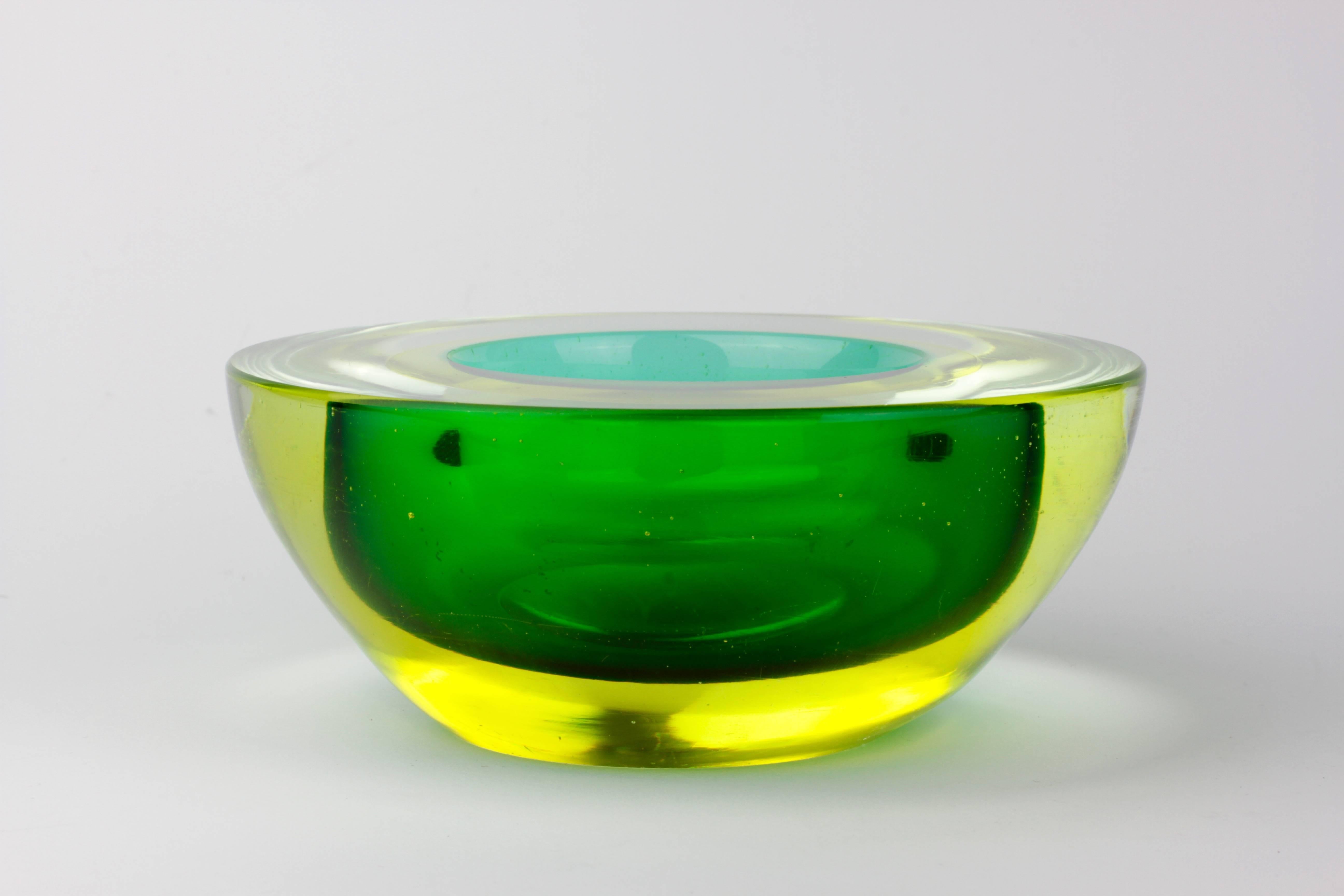 A beautiful and rare bowl by master Murano glass maker Archimede Seguso, circa 1960. We have never seen this combination of colours before - the neon yellow over emerald green over turquoise is understated and elegantly simple resulting is a simply
