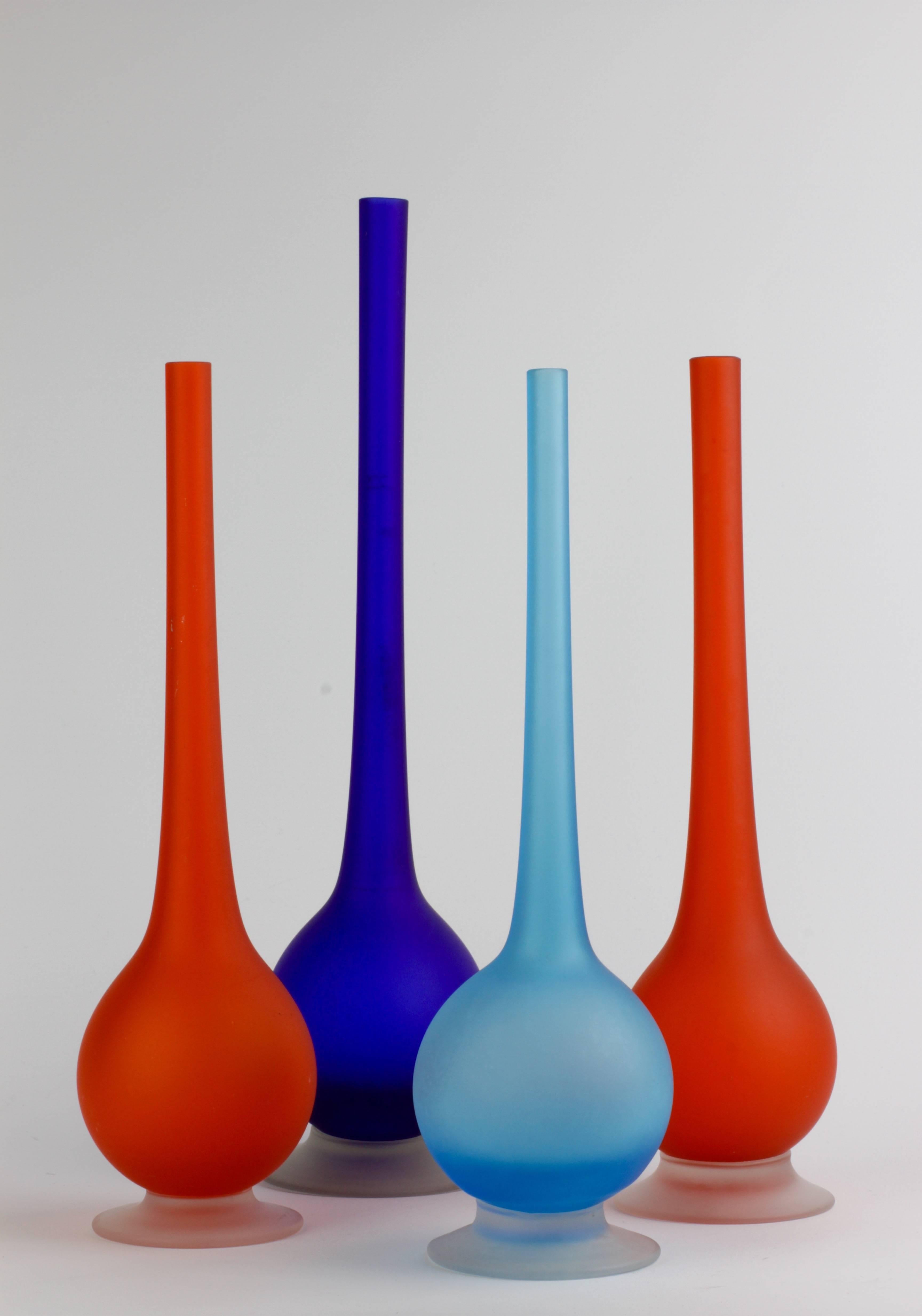 Stunning set of four Mid-Century Modern vibrant jellybean colored / colored satin Murano glass pencil vases by Carlo Moretti, circa 1970.

An absolutely bold yet elegant design with the use of bright, vivid blue and orange combined with the
