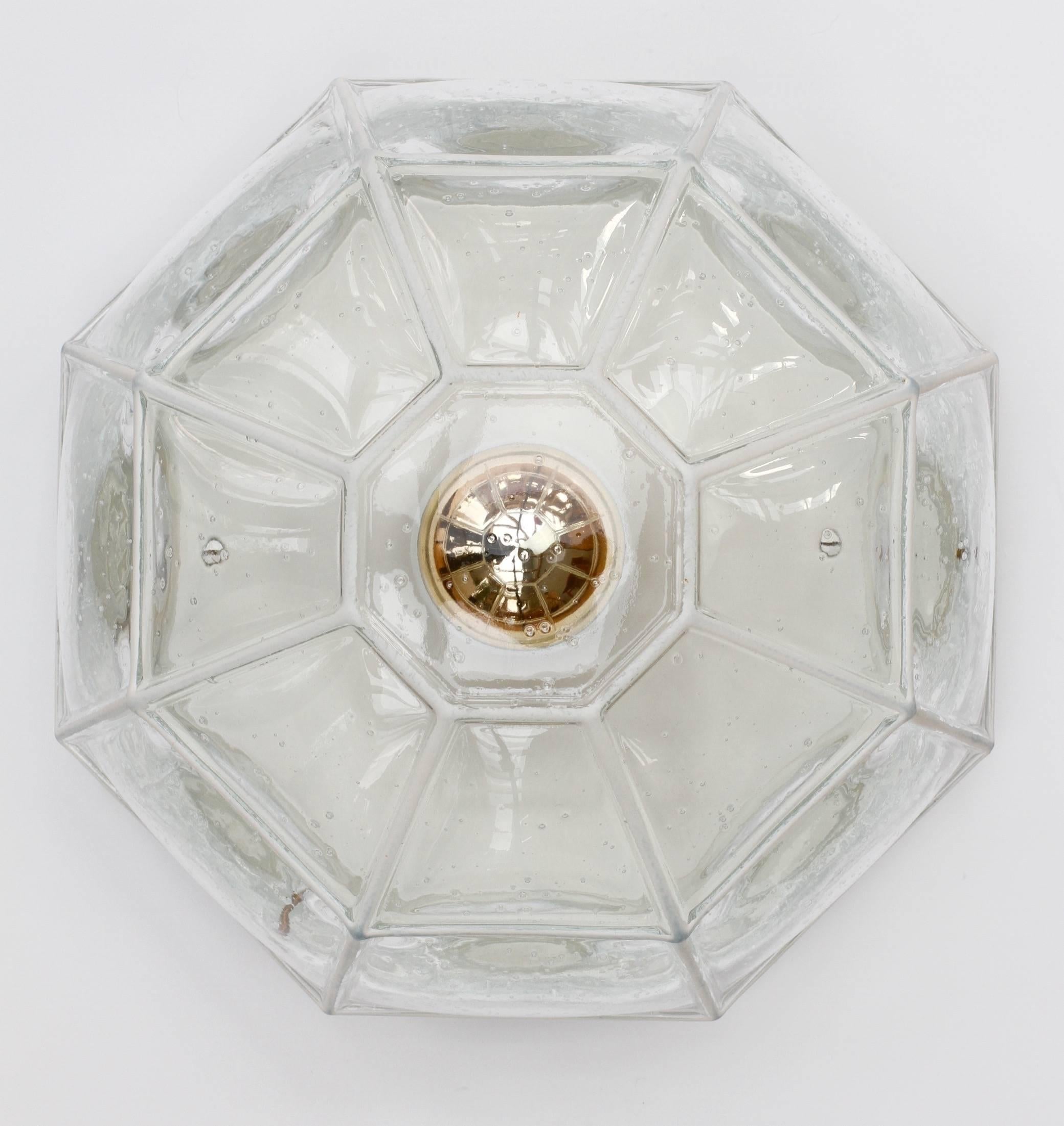 Beautifully minimal, geometric and simply shaped large wall or ceiling flush mount light fixture by Glashütte Limburg, Germany, circa 1965. The bubble glass bulges slightly out of its white 